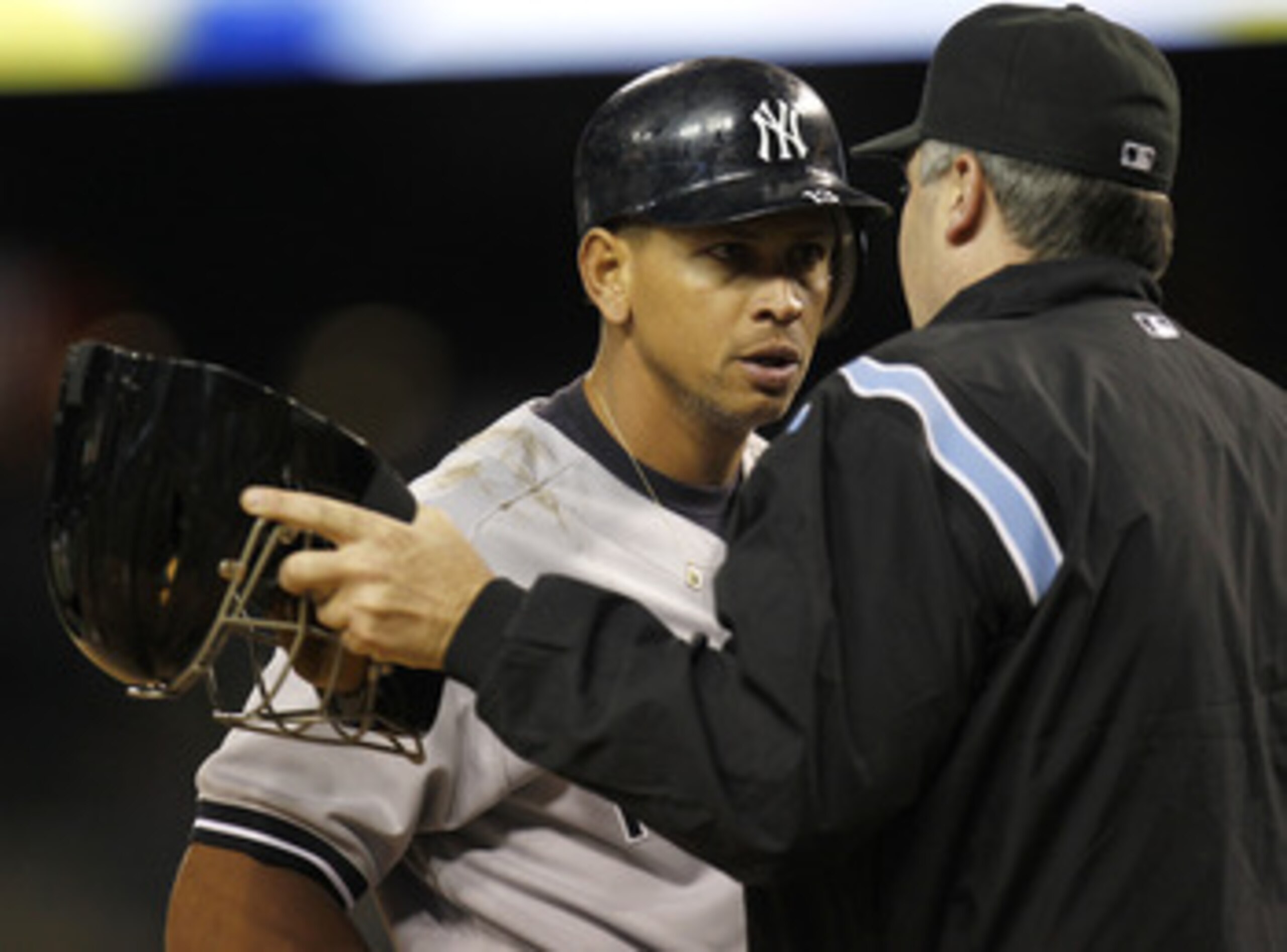 DETROIT, MI - MAY 04: Alex Rodriguez #13 of the New York Yankees talks with home plate umpire Bill Welke after striking out in the ninth inning while playing the Detroit Tigers at Comerica Park on May 4, 2011 in Detroit, Michigan. Detroit won the game 4-0