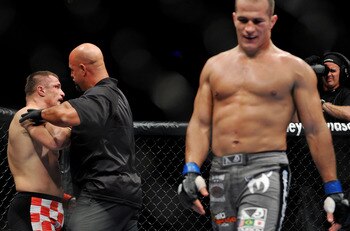 DALLAS - SEPTEMBER 19:  UFC fighter Mirko Cro Cop (L) is stopped by referee after losing to opponent UFC fighter Junior Dos Santo (R) during their Heavyweight bout at UFC 103: Franklin vs. Belfort at the American Airlines Center on September 19, 2009 in D