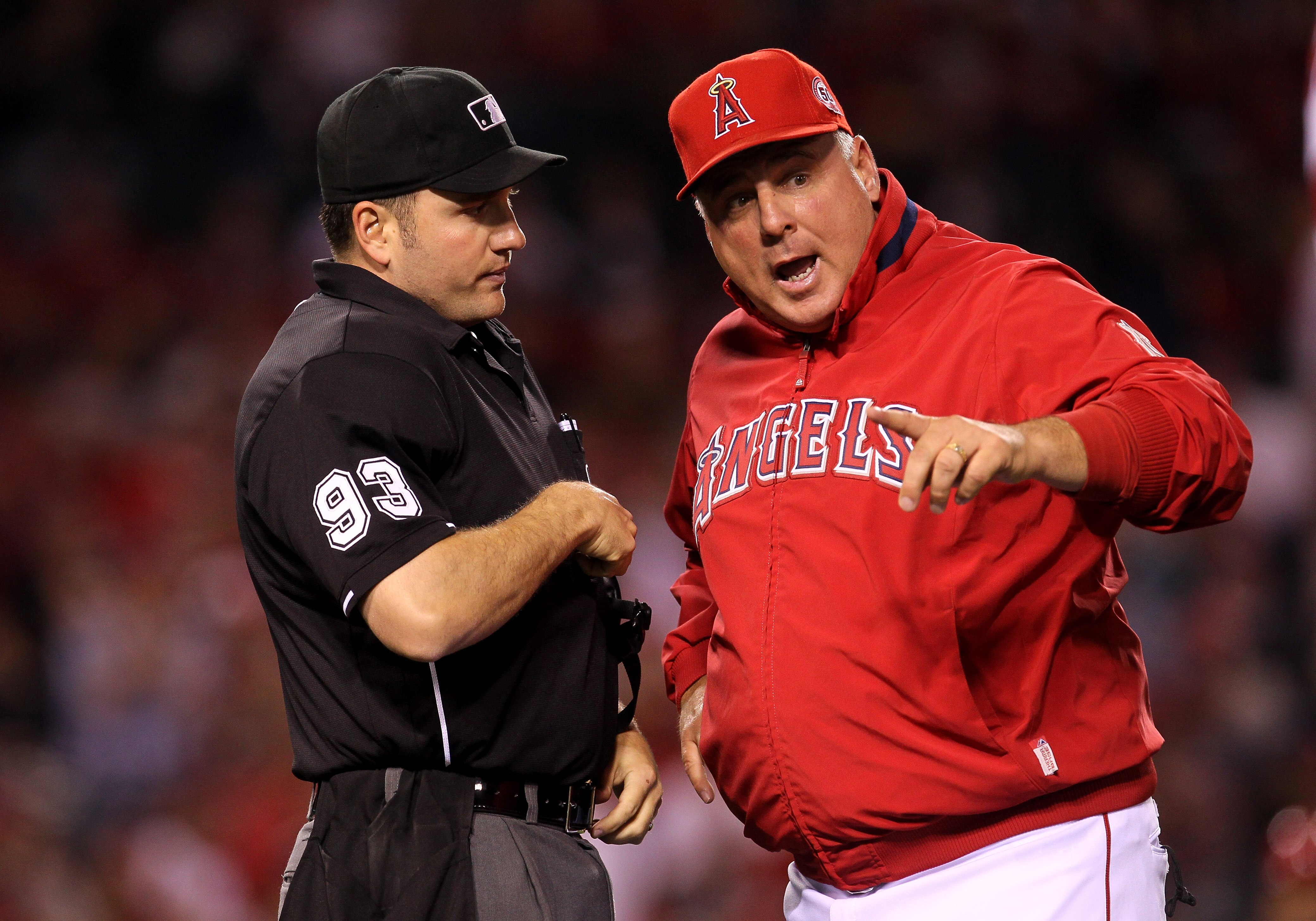 ANAHEIM, CA - MAY 11:  Manager Mike Scioscia of the Los Angeles Angels of Anaheim argues with home plate umpire Dan Bellino during the game with the Chicago White Sox on May 11, 2011 at Angel Stadium in Anaheim, California.   (Photo by Stephen Dunn/Getty