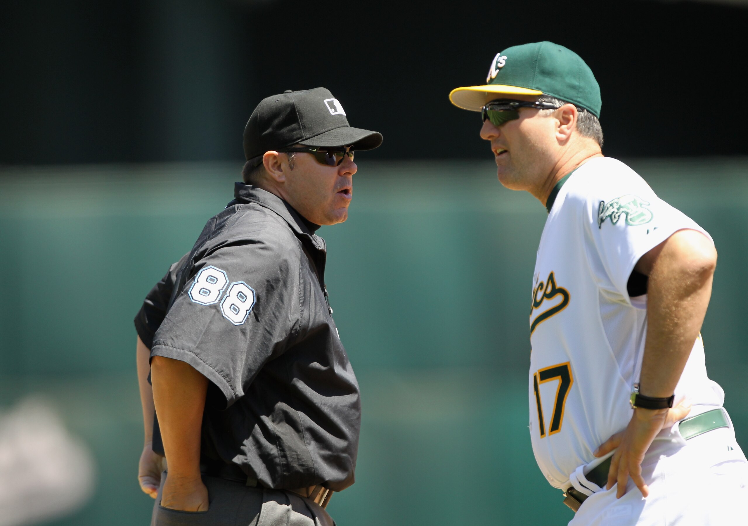 OAKLAND, CA - MAY 02:  Manger Bob Geren of the Oakland Athletics argues a call with thrid base umpire Doug Eddings during their game against the Texas Rangers at Oakland-Alameda County Coliseum on May 2, 2011 in Oakland, California.  (Photo by Ezra Shaw/G