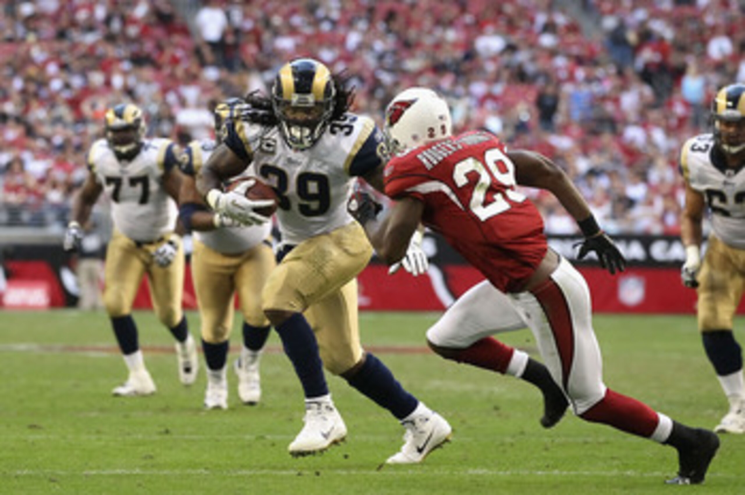 GLENDALE, AZ - DECEMBER 05:  Runningback Steven Jackson #8 of the St. Louis Rams rushes the football against Dominique Rodgers-Cromartie #29 of the Arizona Cardinals during the NFL game at the University of Phoenix Stadium on December 5, 2010 in Glendale,