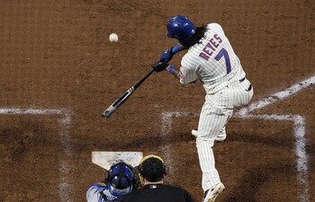NEW YORK, NY - MAY 07:  Jose Reyes #7 of the New York Mets connects on a second inning RBI single against the Los Angeles Dodgers on May 7, 2011 at Citi Field in the Flushing neighborhood of the Queens borough of New York City.  (Photo by Jim McIsaac/Gett