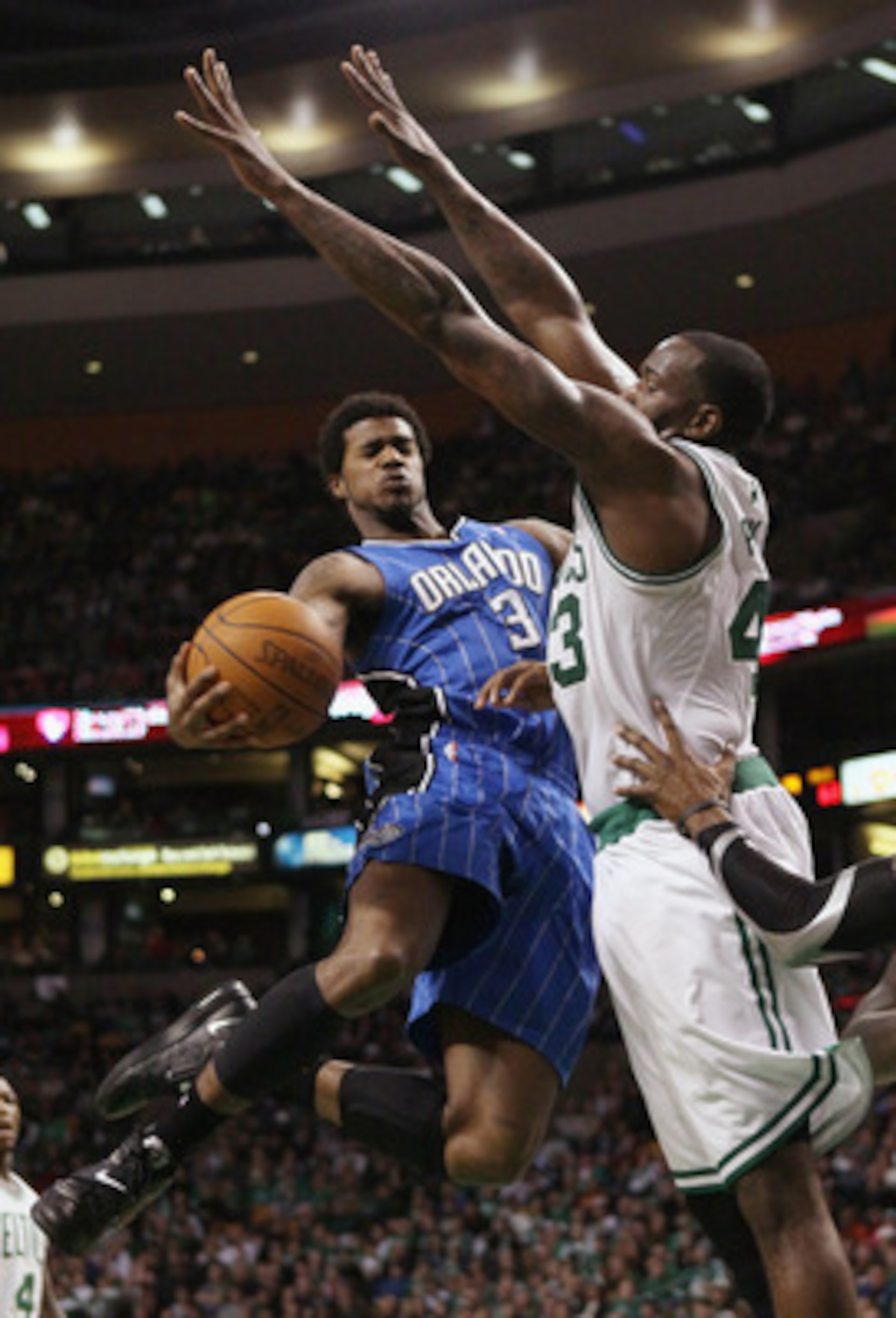 BOSTON, MA - FEBRUARY 06:  Earl Clark #3 of the Orlando Magic tries to get around Kendrick Perkins #43 of the Boston Celtics on February 6, 2011 at the TD Garden in Boston, Massachusetts. The Celtics defeated the Magic 91-80. NOTE TO USER: User expressly