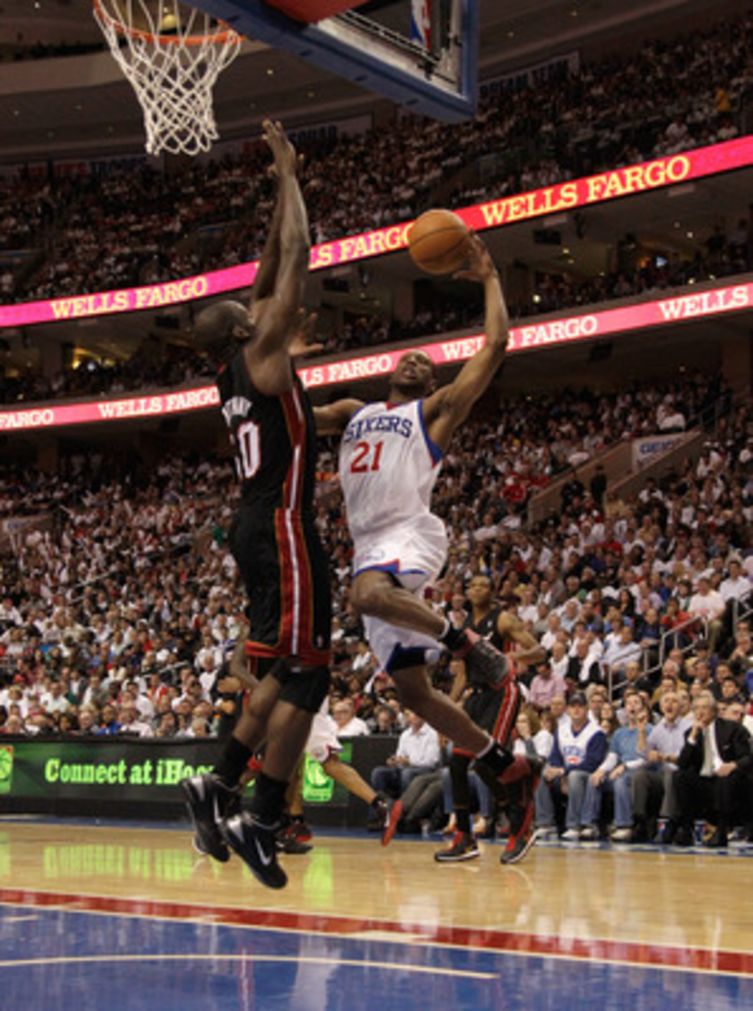 PHILADELPHIA, PA - APRIL 21: Joel Anthony #50 of the Miami Heat defends a Thaddeus Young #21 of the Philadelphia 76ers puts up a shot in Game Three of the Eastern Conference Quarterfinals during the 2011 NBA Playoffs at Wells Fargo Center on April 21, 201