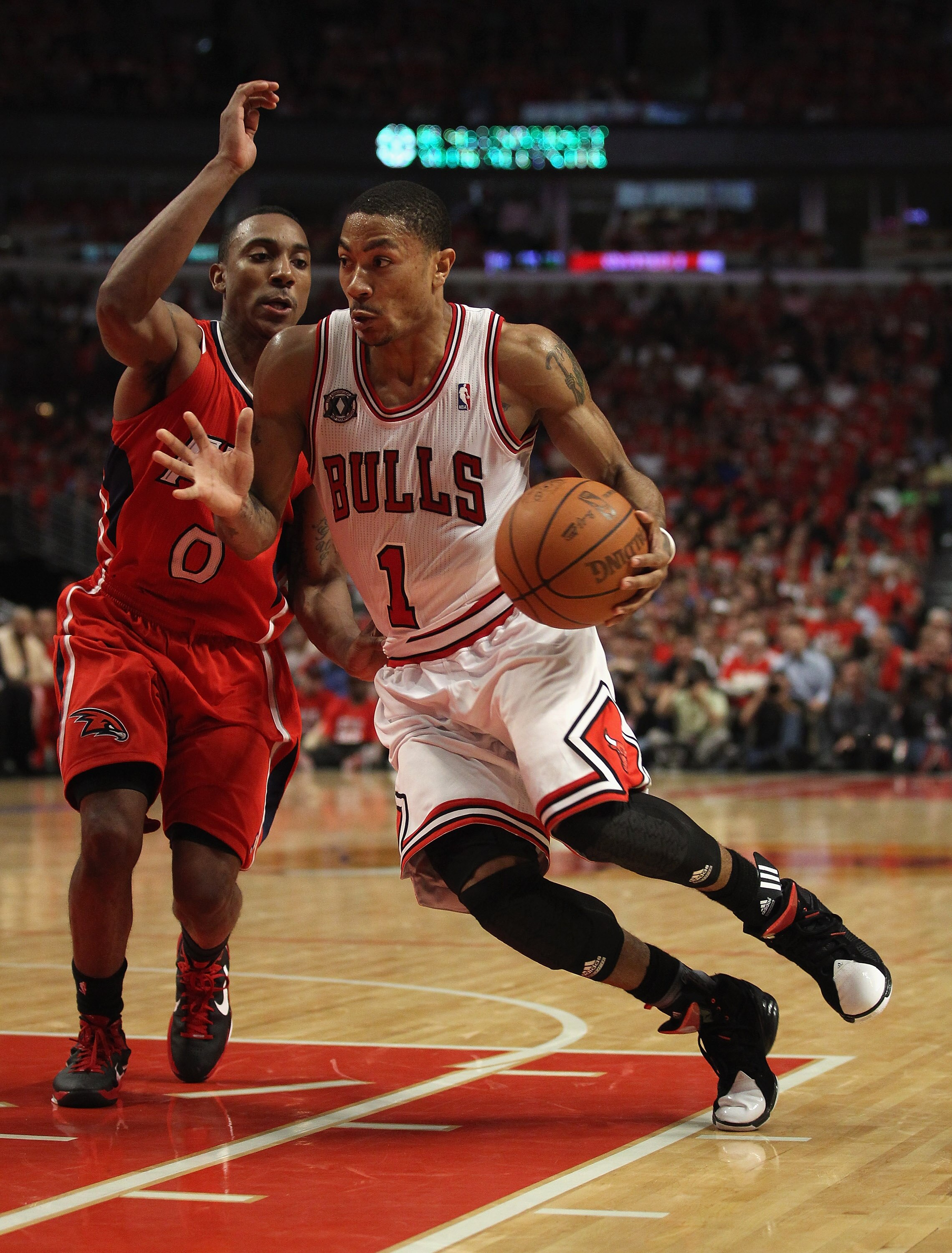 CHICAGO, IL - MAY 10: Derrick Rose #2 of the Chicago Bulls drives past Jeff Teague #0 of the Atlanta Hawks in Game Five of the Eastern Conference Semifinals in the 2011 NBA Playoffs at the United Center on May 10, 2011 in Chicago, Illinois. The Bulls defe