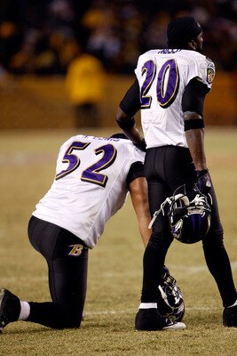 PITTSBURGH - JANUARY 18:  (L-R) Ray Lewis #52 and Ed Reed #20 of  the Baltimore Ravens look on as teammate Willis McGahee is attended to by medical personnel after McGahee was hit hard by Ryan Clark #25 of the Pittsburgh Steelers during the AFC Championsh