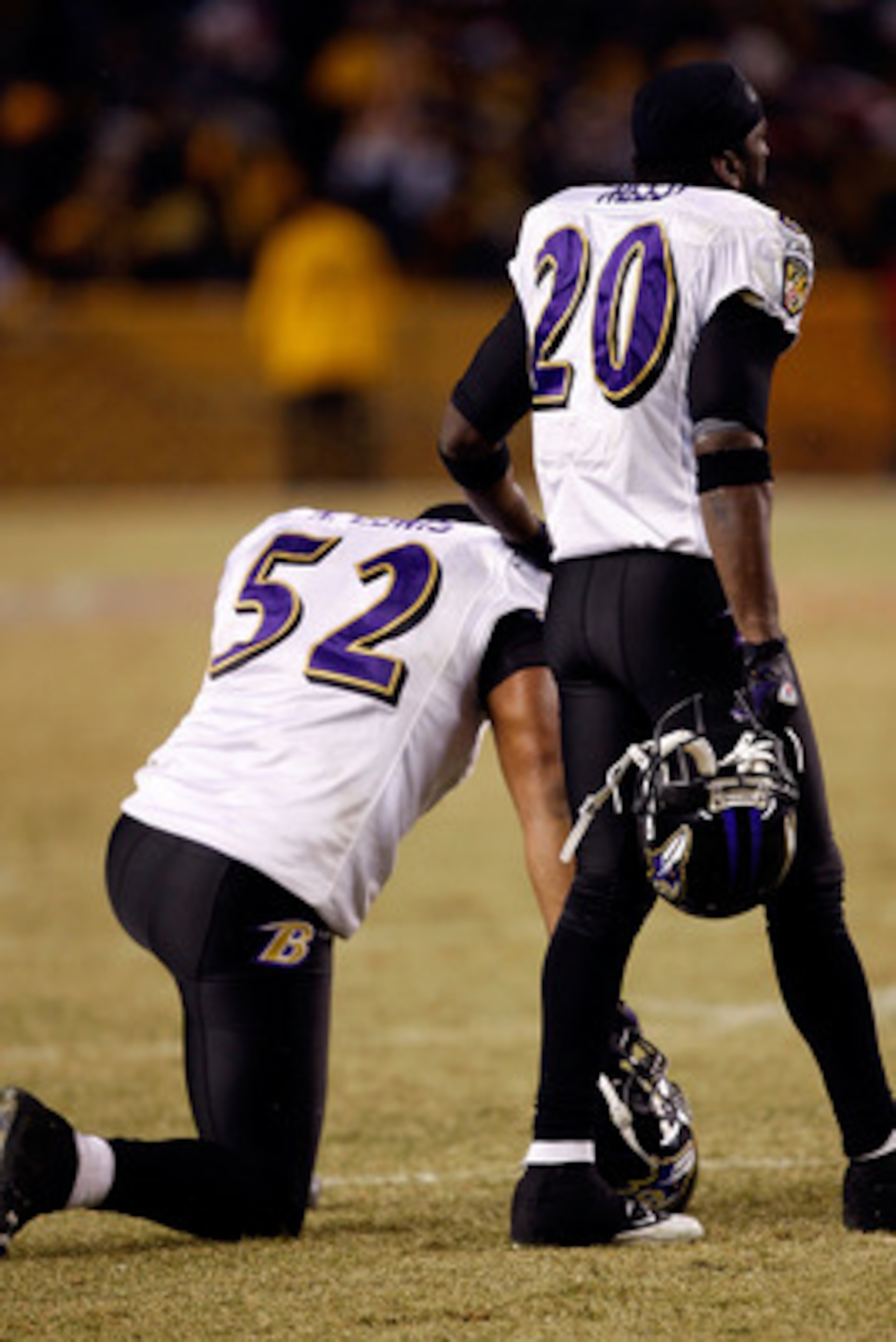 PITTSBURGH - JANUARY 18:  (L-R) Ray Lewis #52 and Ed Reed #20 of  the Baltimore Ravens look on as teammate Willis McGahee is attended to by medical personnel after McGahee was hit hard by Ryan Clark #25 of the Pittsburgh Steelers during the AFC Championsh