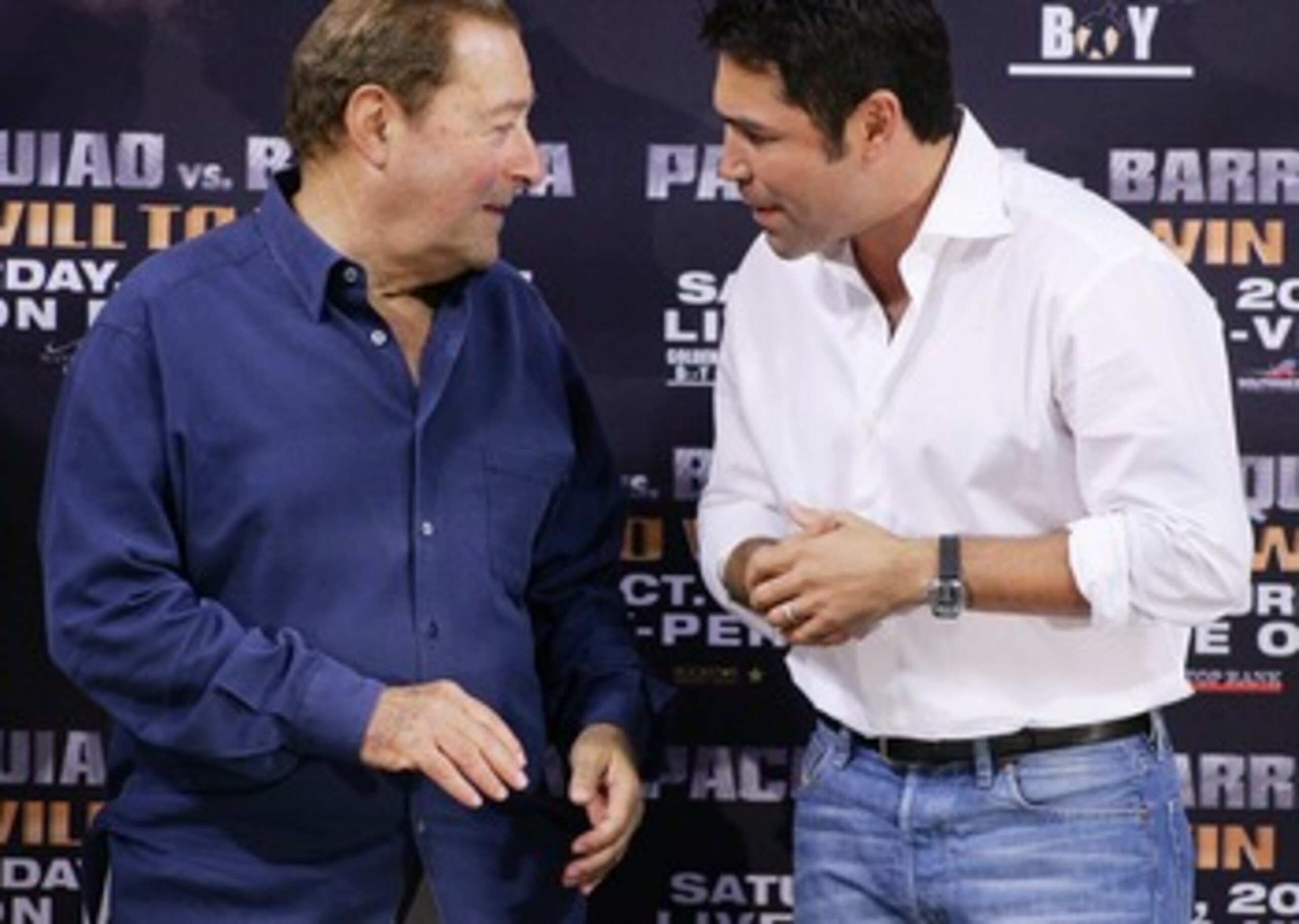 LAS VEGAS - OCTOBER 05:  Boxing promoter Bob Arum (L) and boxer and president of Golden Boy Promotions Oscar De La Hoya speak at the official weigh-in for boxers Manny Pacquiao and Marco Antonio Barrera at the Mandalay Bay Events Center October 5, 2007 in