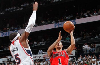 ATLANTA, GA - MAY 12:  Derrick Rose #1 of the Chicago Bulls shoots against Josh Smith #5 of the Atlanta Hawks in Game Six of the Eastern Conference Semifinals in the 2011 NBA Playoffs at Phillips Arena on May 12, 2011 in Atlanta, Georgia.  NOTE TO USER: U