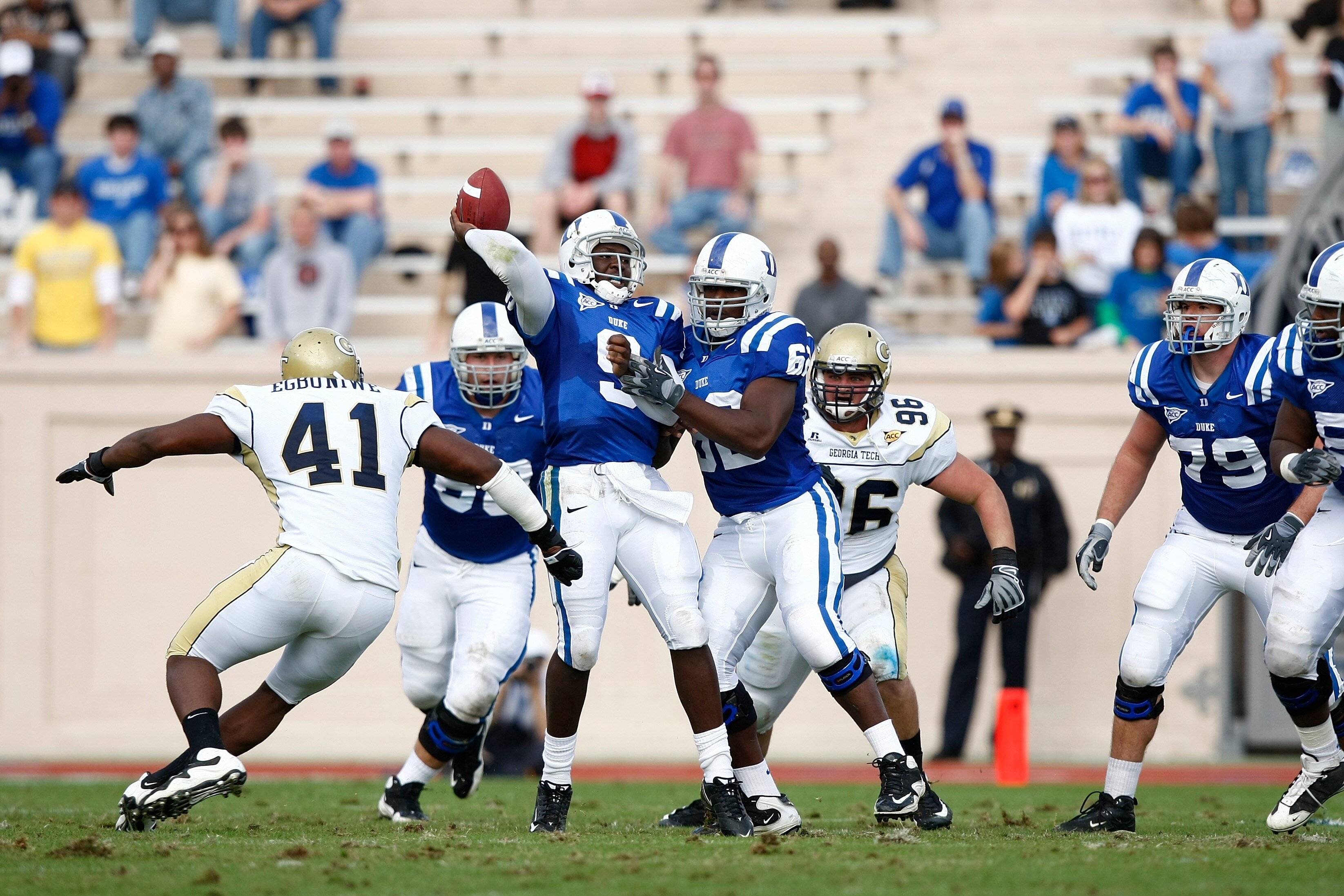 DURHAM, NC - NOVEMBER 14:  Thaddeus Lewis #9 of the Duke Blue Devils throws a pass while under pressure from Anthony Egbuniwe #41 of the Georgia Tech Yellow Jackets during first half action at Wallace Wade Stadium on November 14, 2009 in Durham, North Car