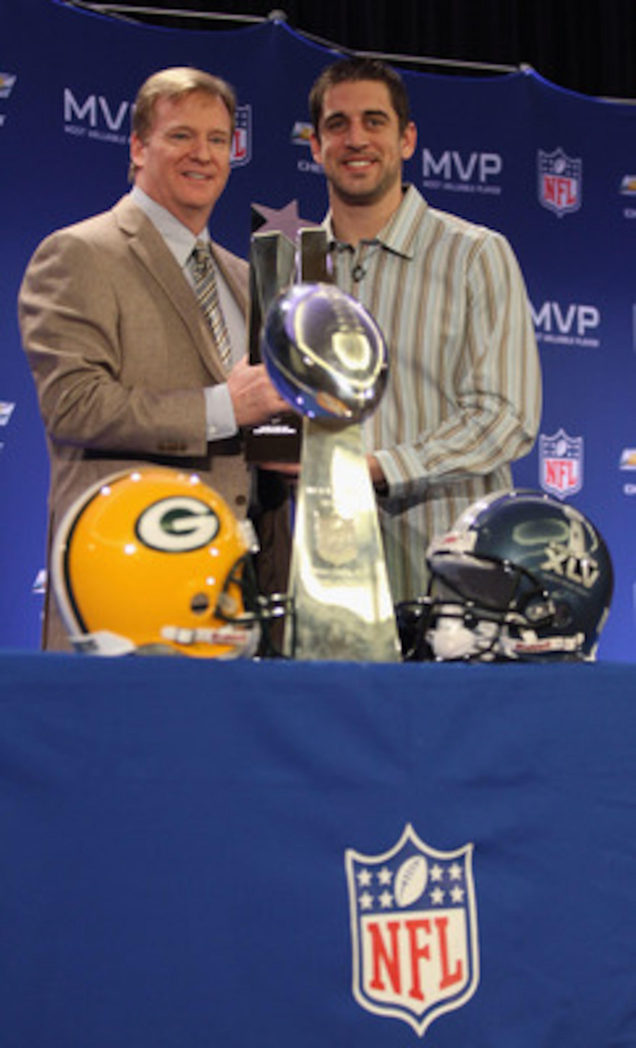 DALLAS, TX - FEBRUARY 07:  NFL Commissioner Roger Goodell (L) and Green Bay Packers quarterback Aaron Rodgers (R) pose with the MVP trophy after speaking to the media during a press conference at Super Bowl XLV Media Center on February 7, 2011 in Dallas, 