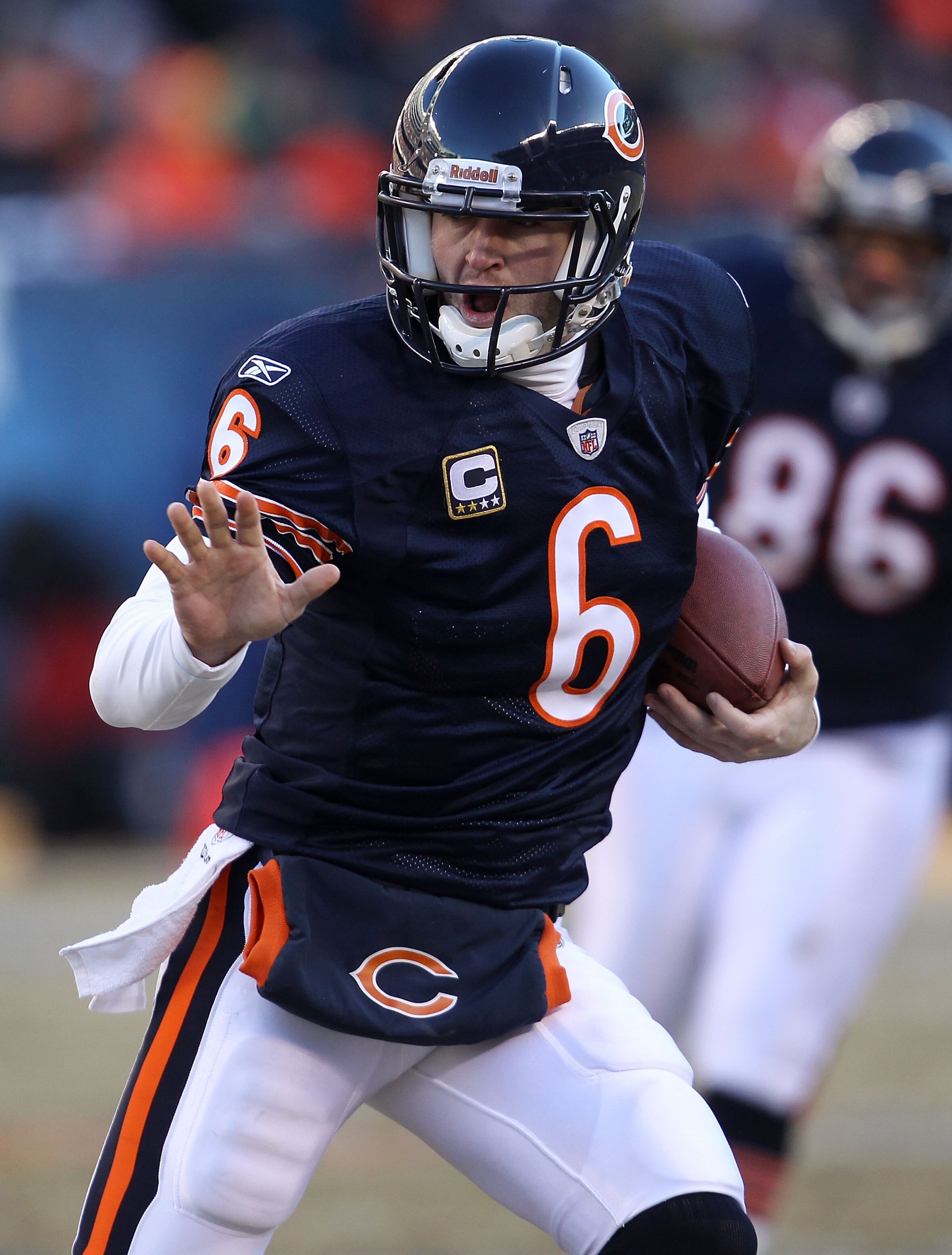 CHICAGO, IL - JANUARY 23:  Quarterback Jay Cutler #6 of the Chicago Bears runs the ball ahead of Clay Matthews #52 of the Green Bay Packers in the second quarter of the NFC Championship Game at Soldier Field on January 23, 2011 in Chicago, Illinois.  (Pho