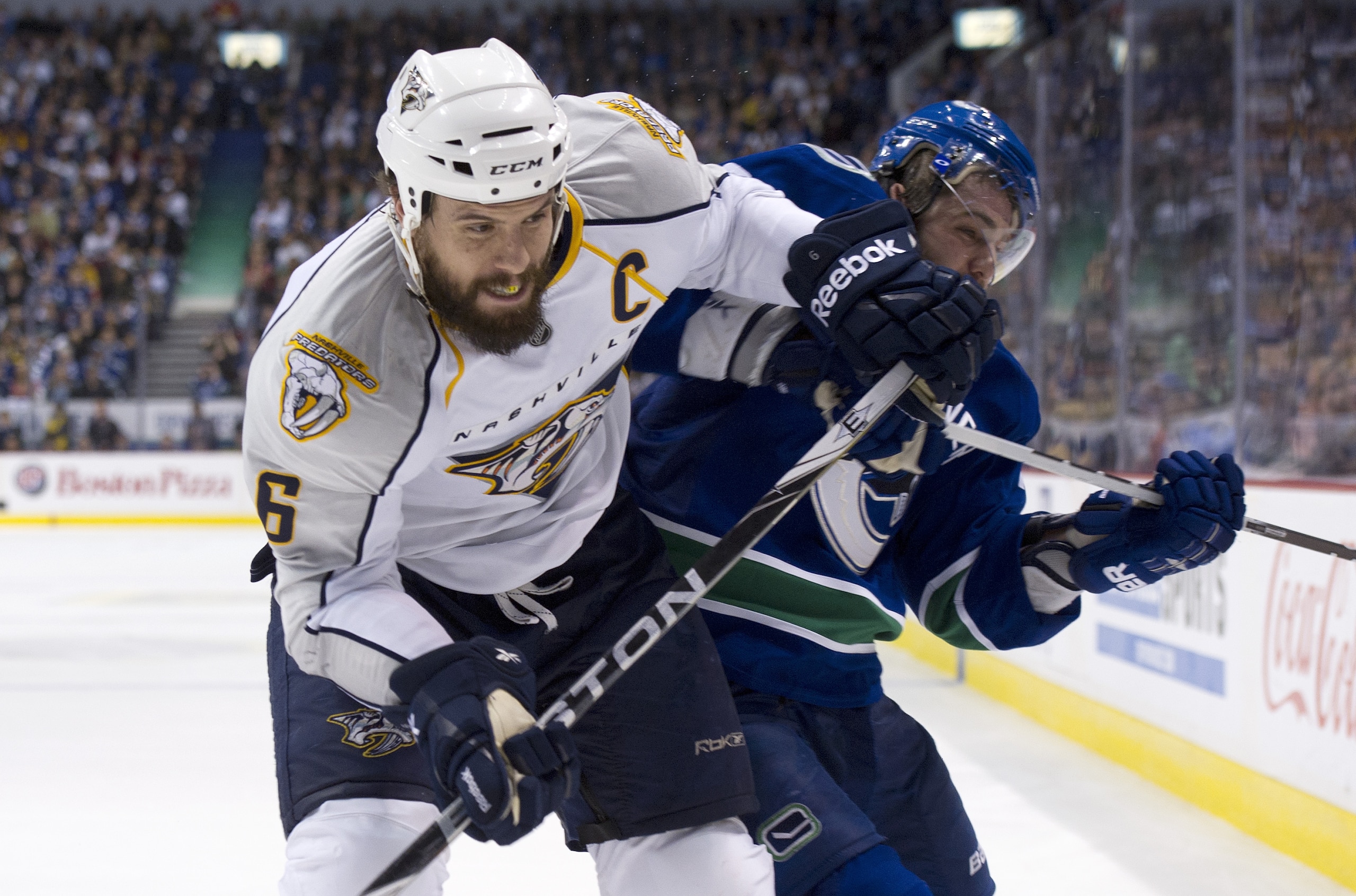VANCOUVER, CANADA - MAY 7: Shea Weber #6 of the Nashville Predators hits Chris Higgins #20 while battling for the puck in the corner during the third period in Game Five of the Western Conference Semifinals during the 2011 NHL Stanley Cup Playoffs on May