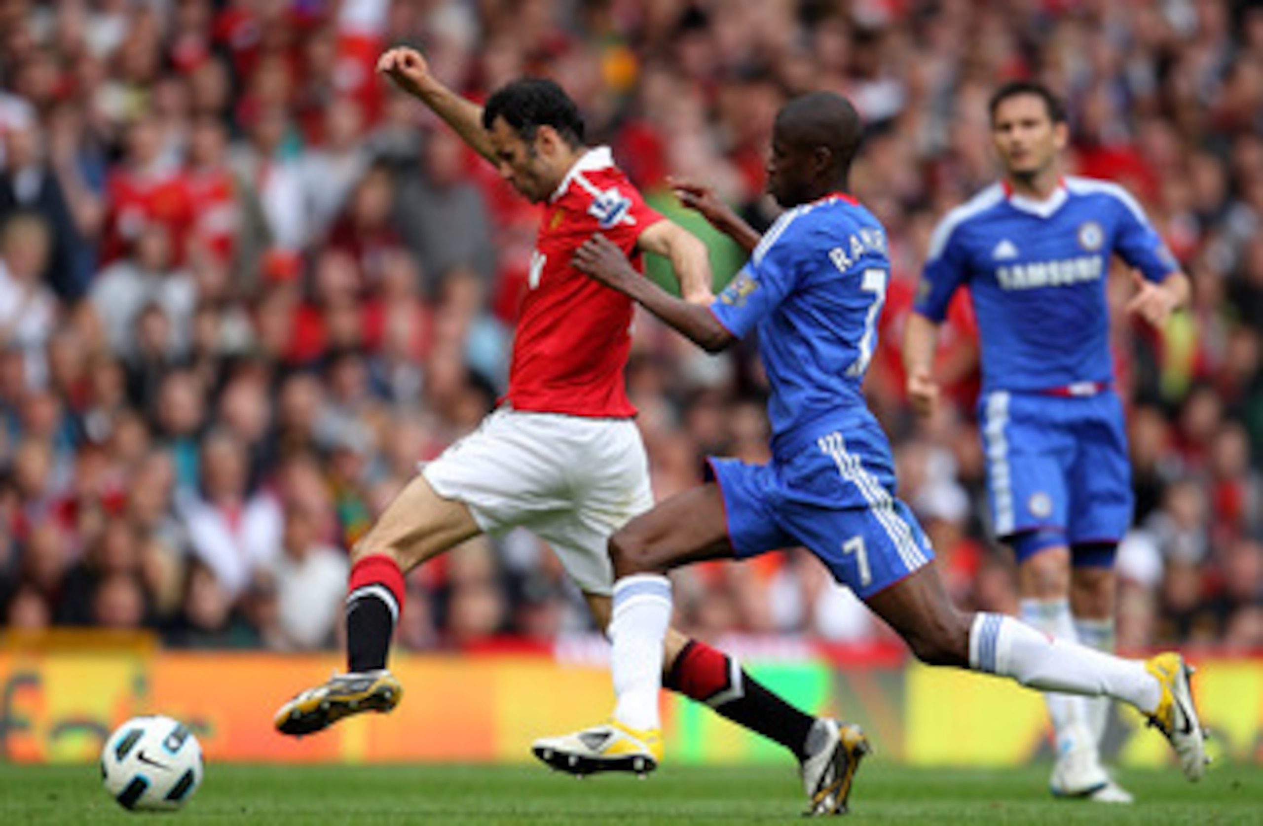 MANCHESTER, ENGLAND - MAY 08:  Ryan Giggs of Manchester United competes with Ramires of Chelsea during the Barclays Premier League match between Manchester United and Chelsea at Old Trafford on May 8, 2011 in Manchester, England.  (Photo by Alex Livesey/G