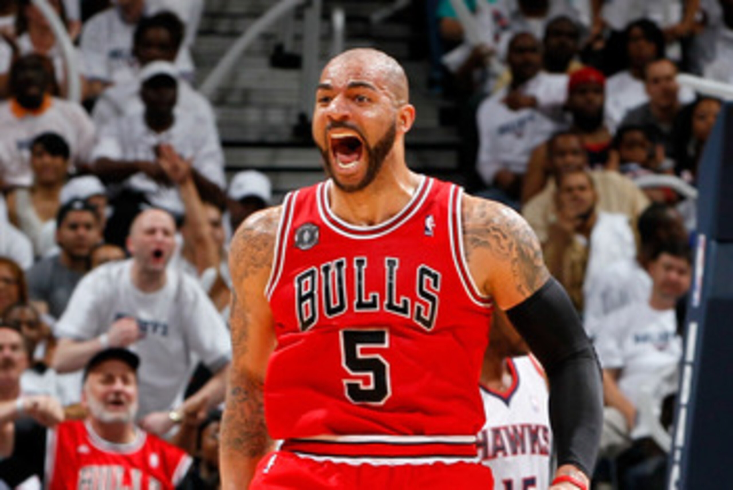 ATLANTA, GA - MAY 12:  Carlos Boozer #5 of the Chicago Bulls reacts after Omer Asik #3 scored a basket and a foul against the Atlanta Hawks in Game Six of the Eastern Conference Semifinals in the 2011 NBA Playoffs at Phillips Arena on May 12, 2011 in Atla