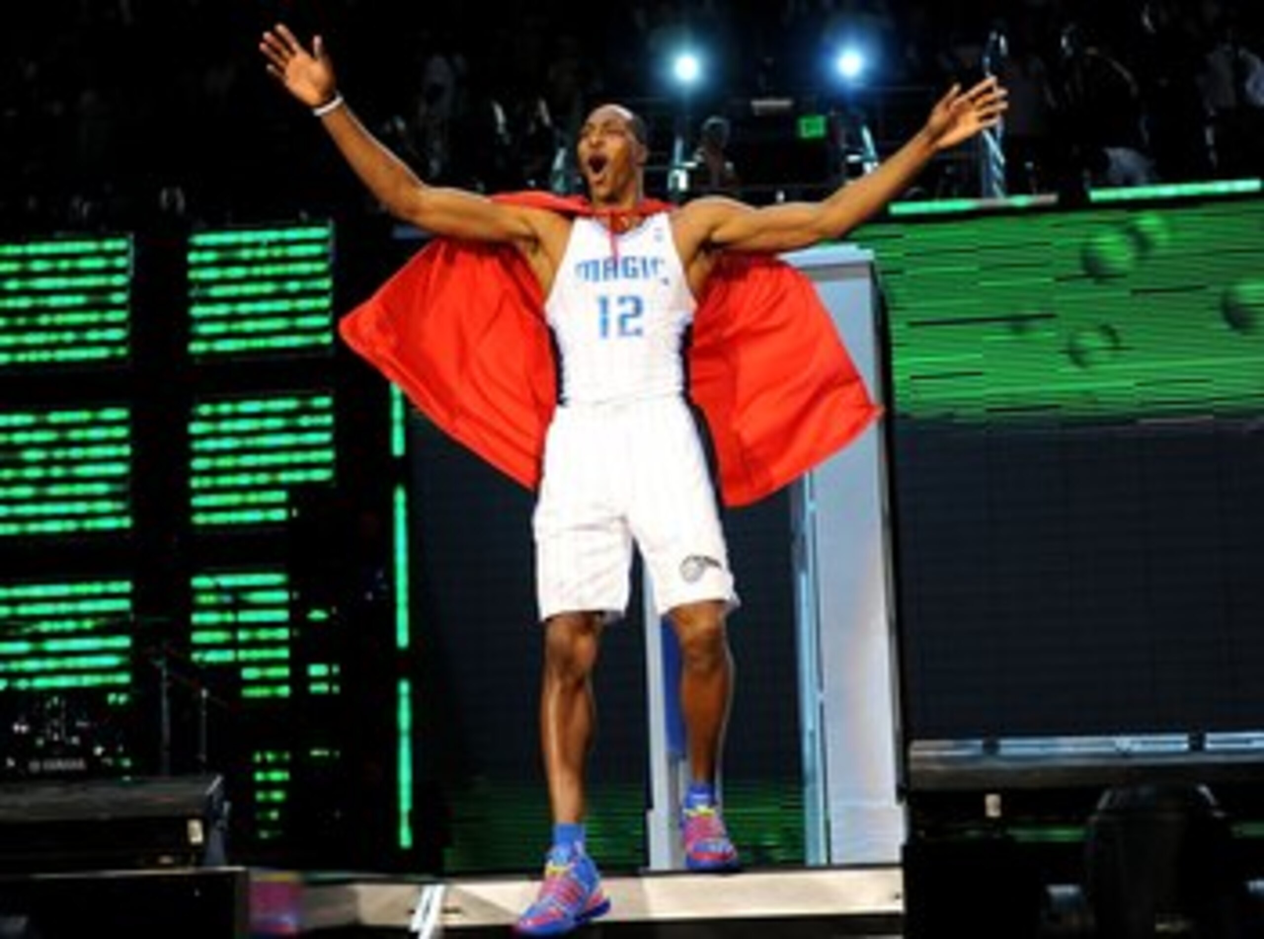 PHOENIX - FEBRUARY 14:  Dwight Howard of the Orlando Magic emerges from a phone booth wearing a Superman cape during the Sprite Slam Dunk Contest on All-Star Saturday Night, part of 2009 NBA All-Star Weekend at US Airways Center on February 14, 2009 in Ph