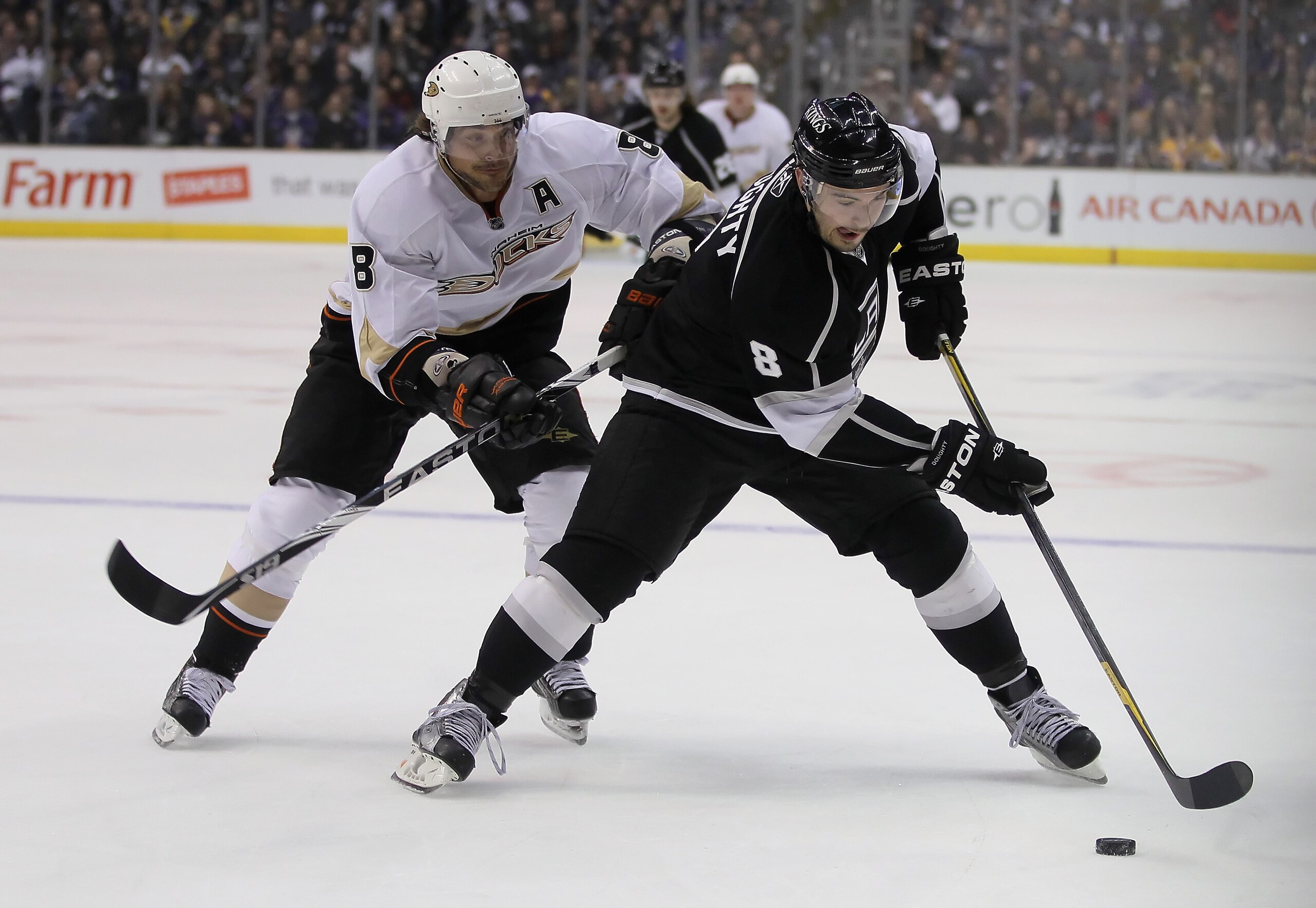 LOS ANGELES, CA - APRIL 09:  Drew Doughty #8 of the Los Angeles Kings is pursued by Teemu Selanne #8 of the Anaheim Ducks for the puck in the first period at Staples Center on April 9, 2011 in Los Angeles, California.  (Photo by Jeff Gross/Getty Images)
