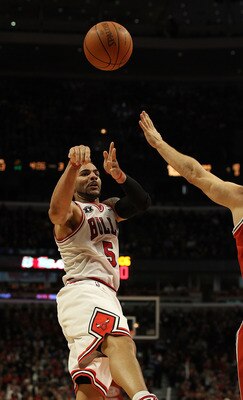 CHICAGO, IL - DECEMBER 28: Carlos Boozer #5 of the Chicago Bulls passes the ball against the Milwaukee Bucks at the United Center on December 28, 2010 in Chicago, Illinois. The Bulls defeated the Bucks 90-77. NOTE TO USER: User expressly acknowledges and