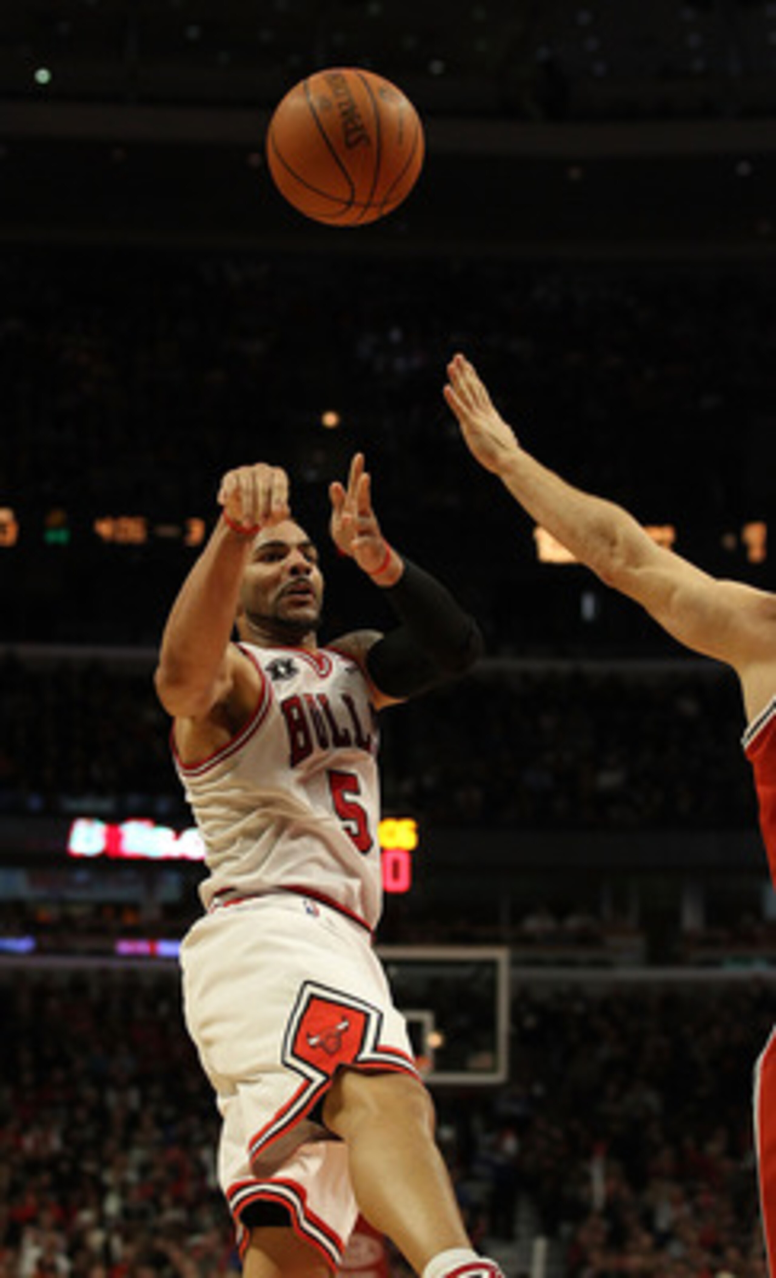 CHICAGO, IL - DECEMBER 28: Carlos Boozer #5 of the Chicago Bulls passes the ball against the Milwaukee Bucks at the United Center on December 28, 2010 in Chicago, Illinois. The Bulls defeated the Bucks 90-77. NOTE TO USER: User expressly acknowledges and