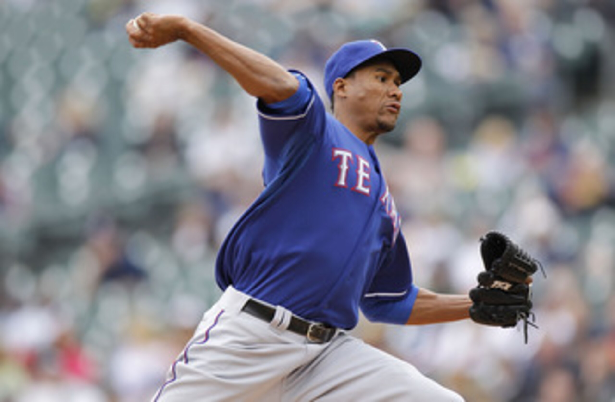 DETROIT, MI - APRIL 11:  Alexi Ogando #41 of the Texas Rangers throws a pitch while playing the Detroit Tigers at Comerica Park on April 11, 2011 in Detroit, Michigan.  (Photo by Gregory Shamus/Getty Images)