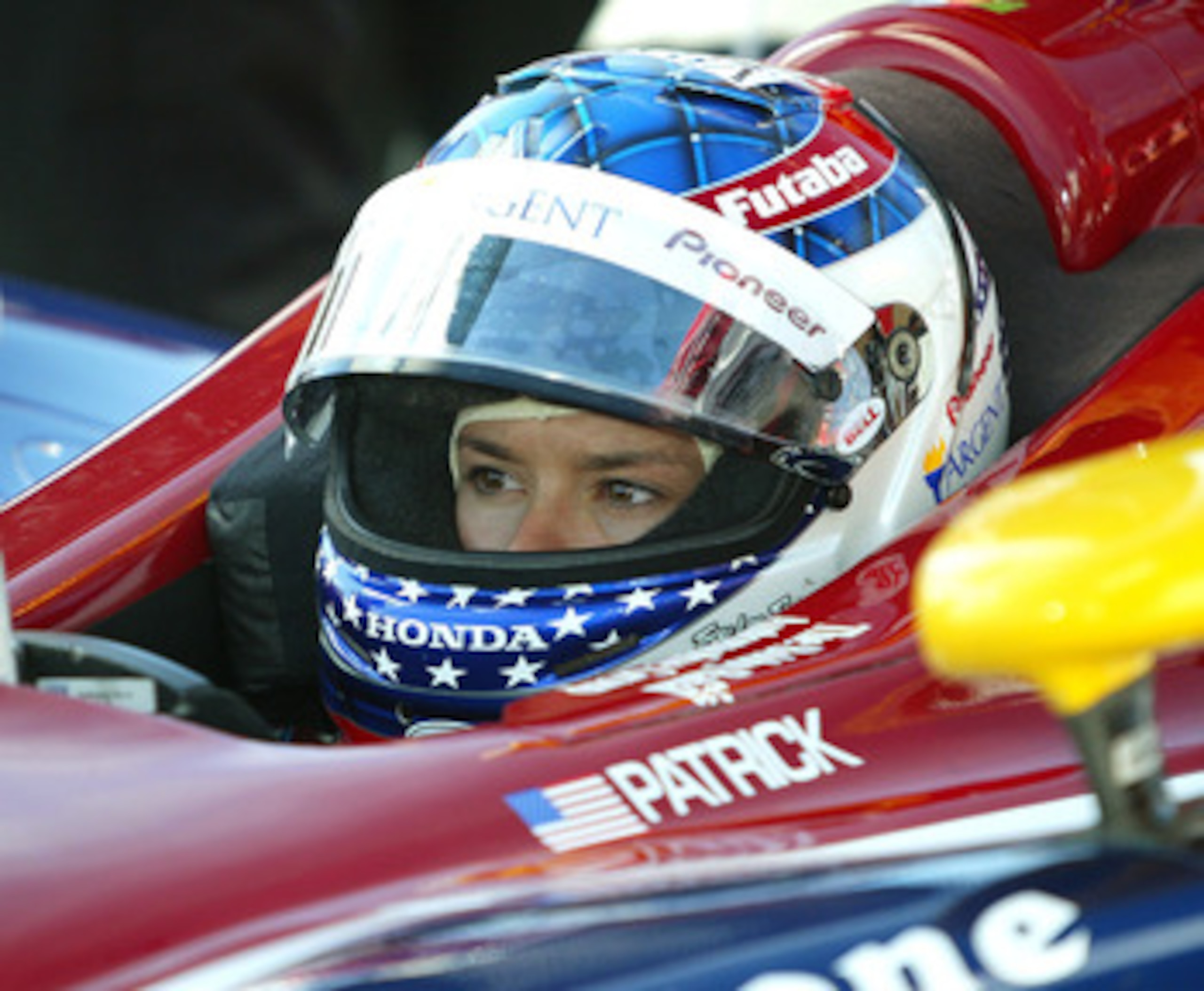 FONTANA, CA - OCTOBER 15:  Race car driver Danica Patrick waits in her car at the California Speedway October 15, 2005 in Fontana. California.  (Photo by Frederick M. Brown/Getty Images)