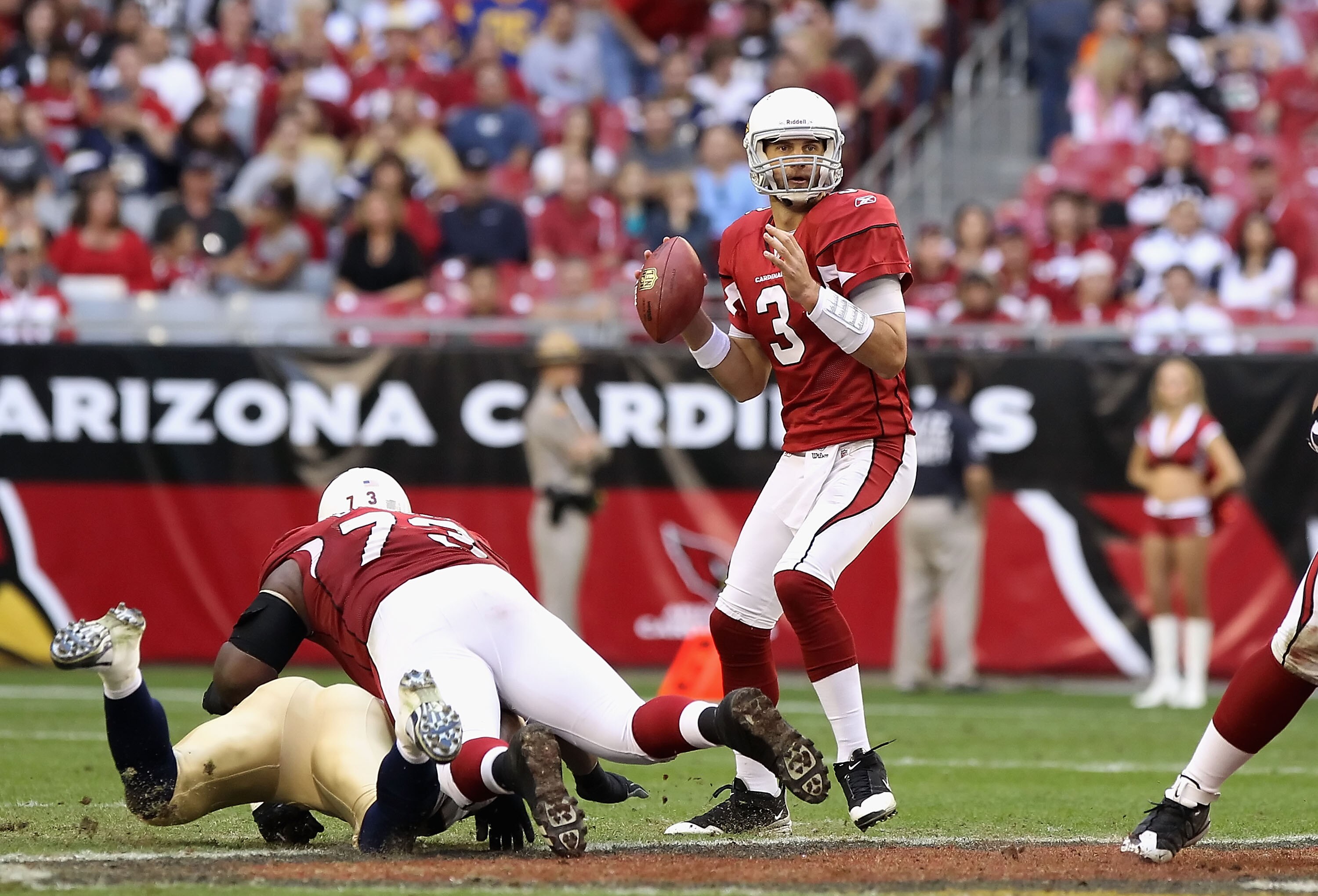 GLENDALE, AZ - DECEMBER 05:  Quarterback Derek Anderson #3 of the Arizona Cardinals scrambles to pass the football during the NFL game against the St. Louis Rams at the University of Phoenix Stadium on December 5, 2010 in Glendale, Arizona. The Rams defea