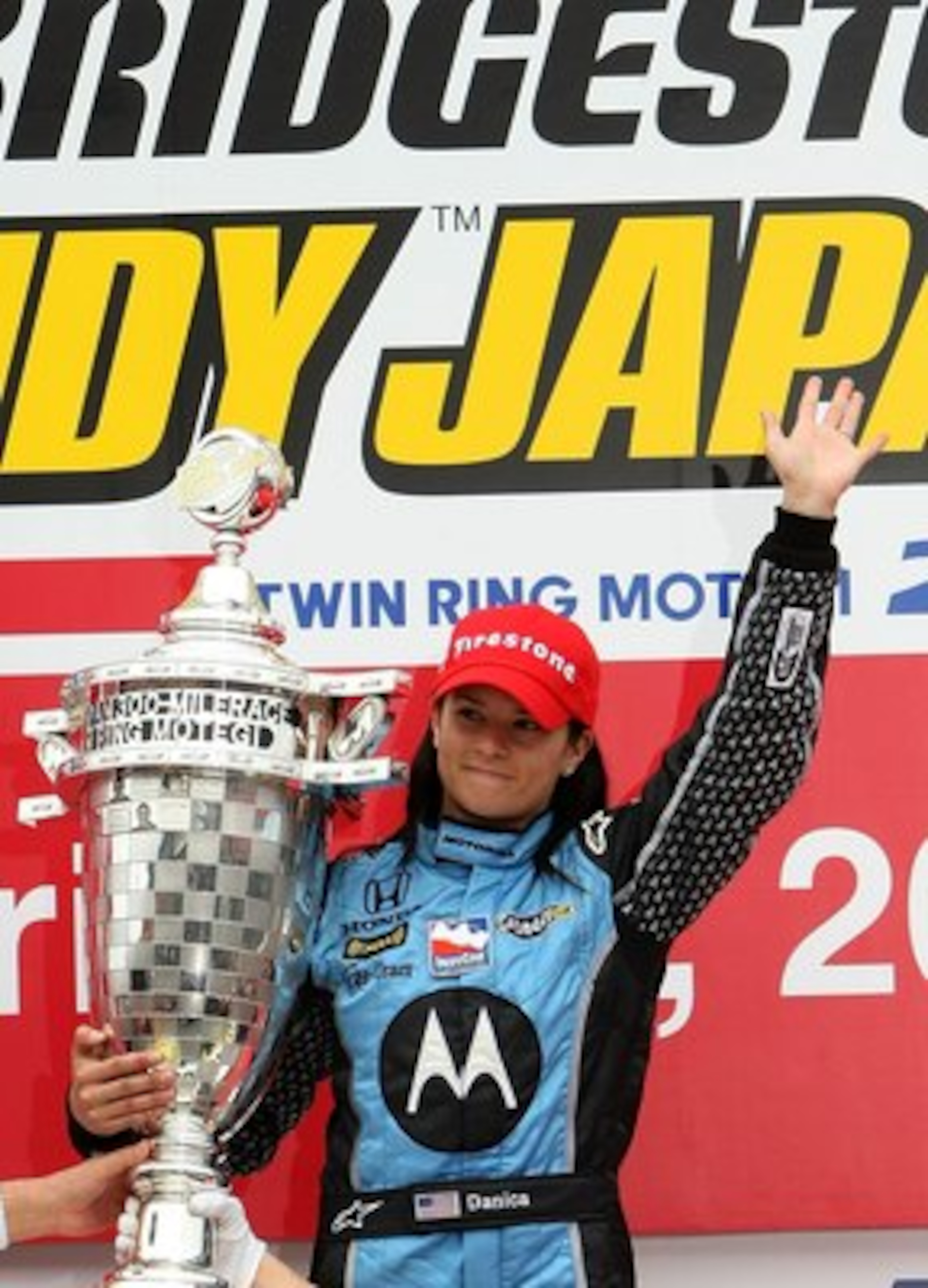 MOTEGI, JAPAN - APRIL 20: Danica Patrick driver of the #7 Motorola Andretti Green Racing Honda Dallara poses with the trophy after winning the IndyCar Series Bridgestone Indy Japan 300 Mile on April 20, 2008 at Twin Ring Motegi in Motegi, Japan. (Photo MOTEGI, JAPAN - APRIL 20: Danica Patrick driver of the #7 Motorola Andretti Green Racing Honda Dallara poses with the trophy after winning the IndyCar Series Bridgestone Indy Japan 300 Mile on April 20, 2008 at Twin Ring Motegi in Motegi, Japan. (Photo