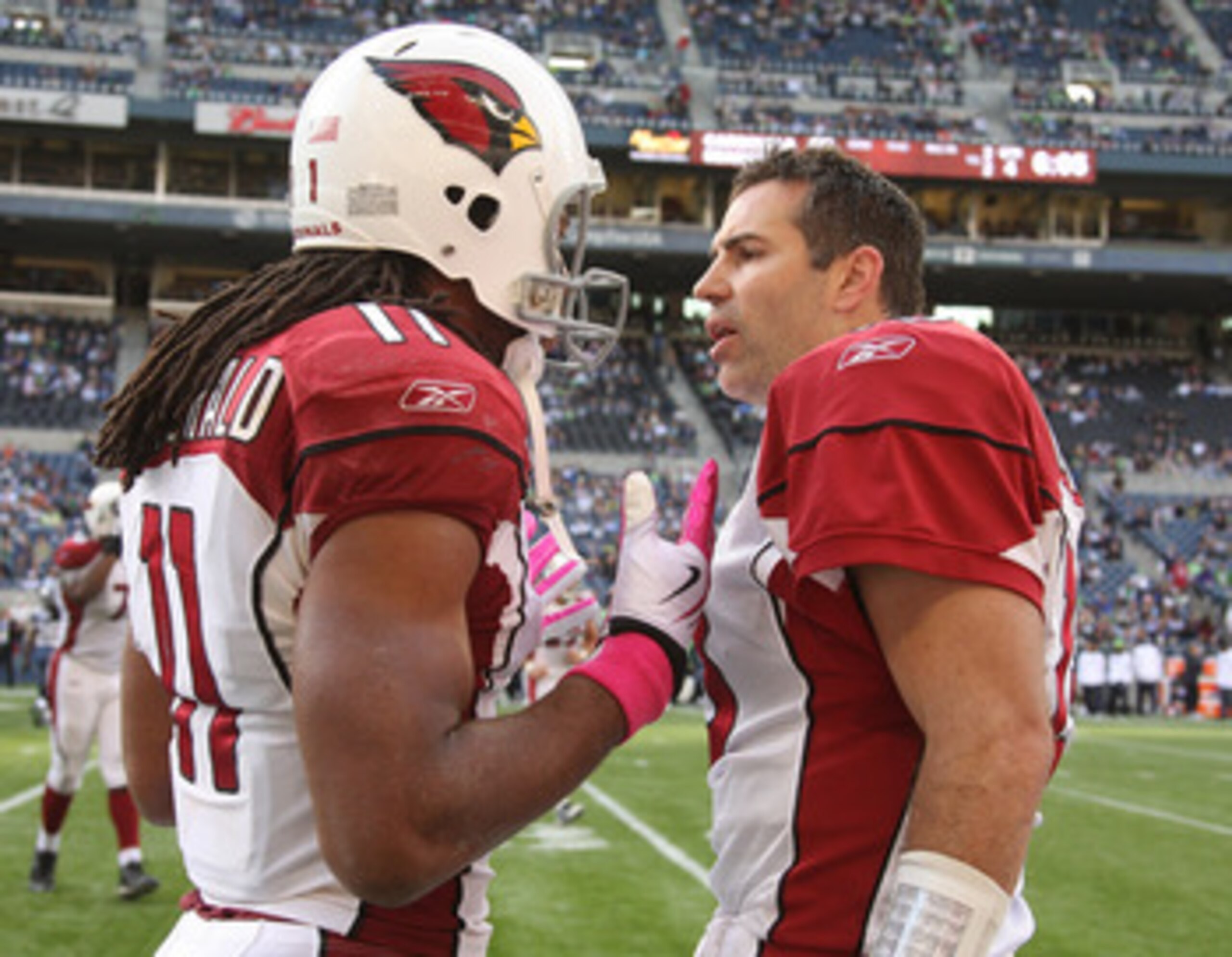 SEATTLE - OCTOBER 18: Quarterback Kurt Warner #13 (R) of the Arizona Cardinals exchanges words with wide receiver Larry Fitzgerald #11during the game against the Seattle Seahawks on October 18, 2009 at Qwest Field in Seattle, Washington. (Photo by Otto Gr
