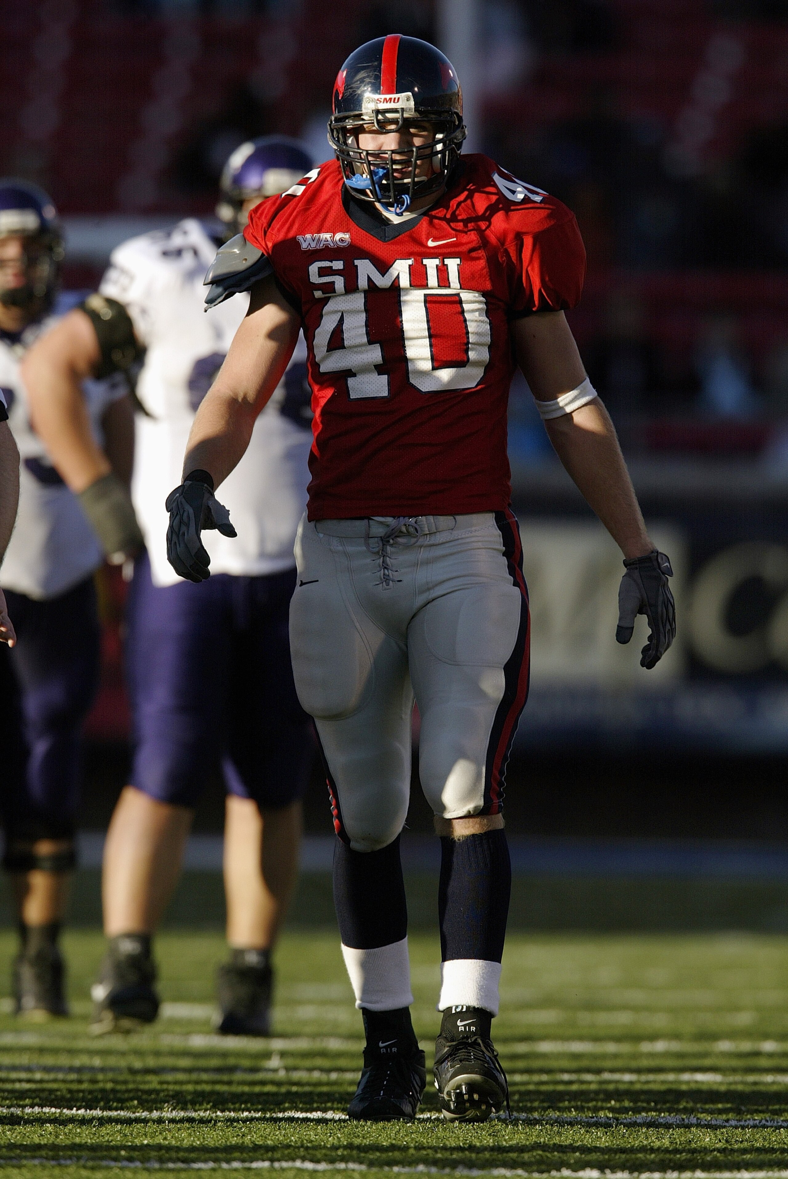 DALLAS - NOVEMBER 29:  Defensive end Justin Rogers #40 of the Southern Methodist University Mustangs on the field during the game against the Texas Christian University Horned Frogs on November 29, 2003 at Gerald J. Ford Stadium in Dallas, Texas. TCU won