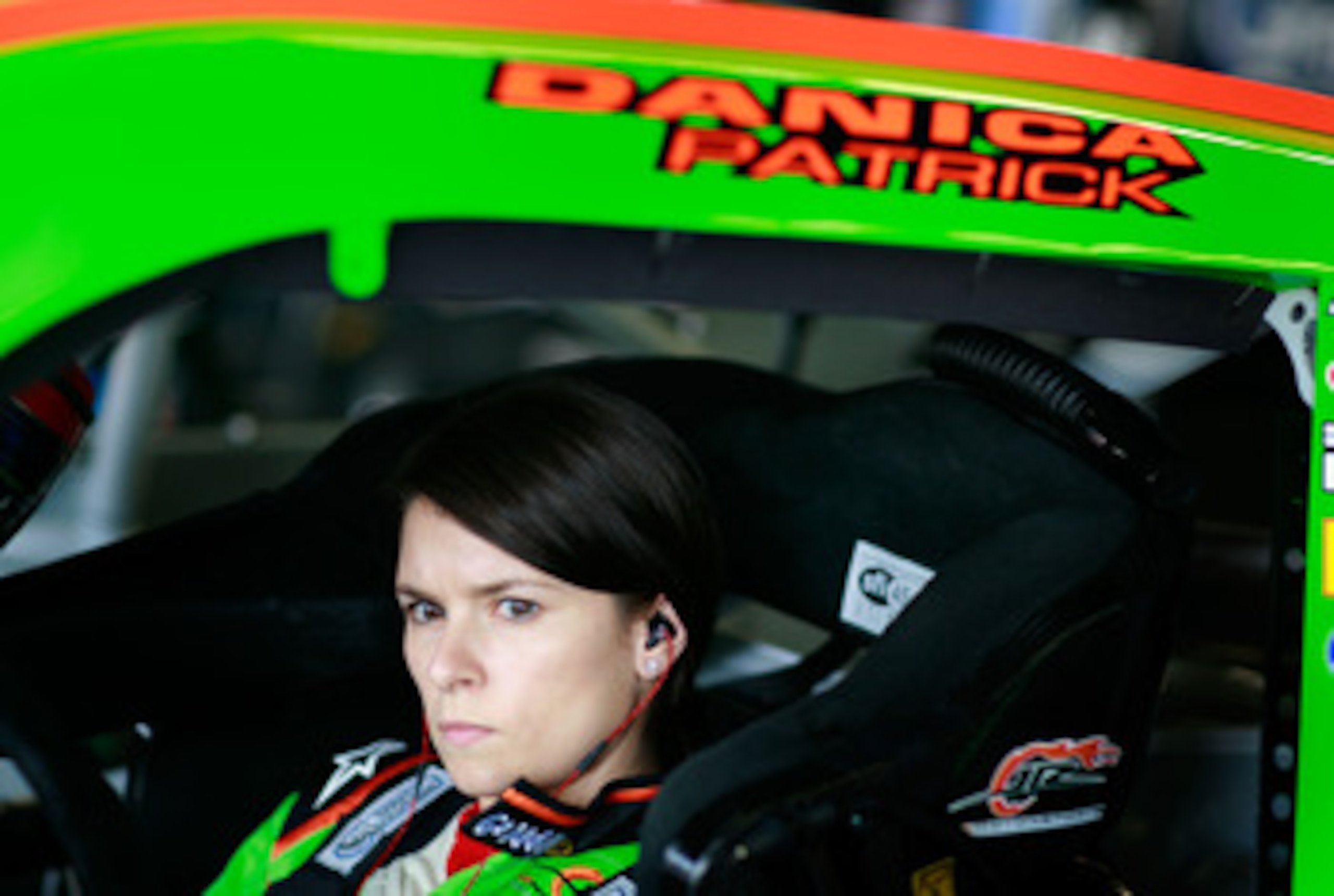 DAYTONA BEACH, FL - FEBRUARY 16:  Danica Patrick, driver of the #7 GoDaddy.com Chevrolet, sits in her car in the garage area during practice for the NASCAR Nationwide Series DRIVE4COPD 300 at Daytona International Speedway on February 16, 2011 in Daytona 