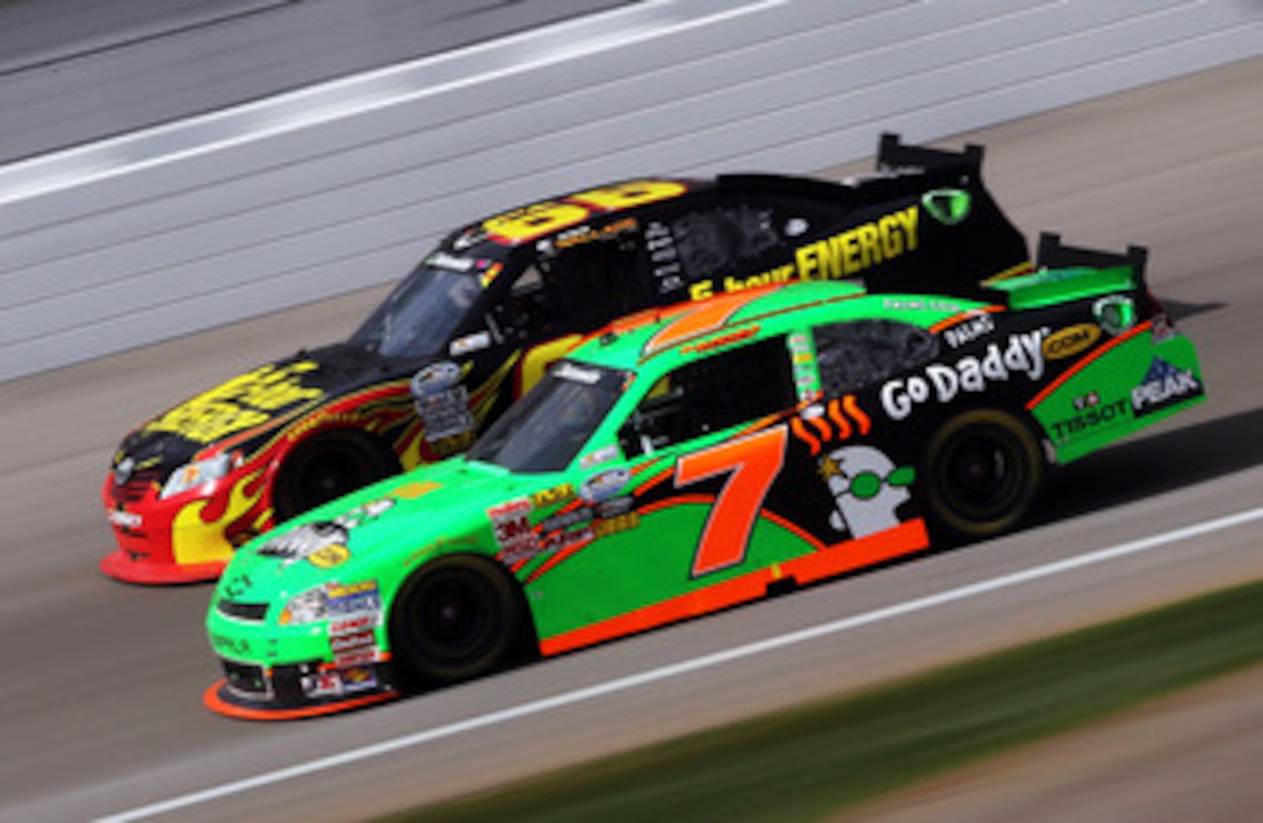 LAS VEGAS, NV - MARCH 05:  Danica Patrick, driver of the #7 GoDaddy.com Chevrolet, races Steve Wallace, driver of the #66 5-Hour Energy Toyota, during the NASCAR Nationwide Series Sam's Town 300 at Las Vegas Motor Speedway on March 5, 2011 in Las Vegas, N