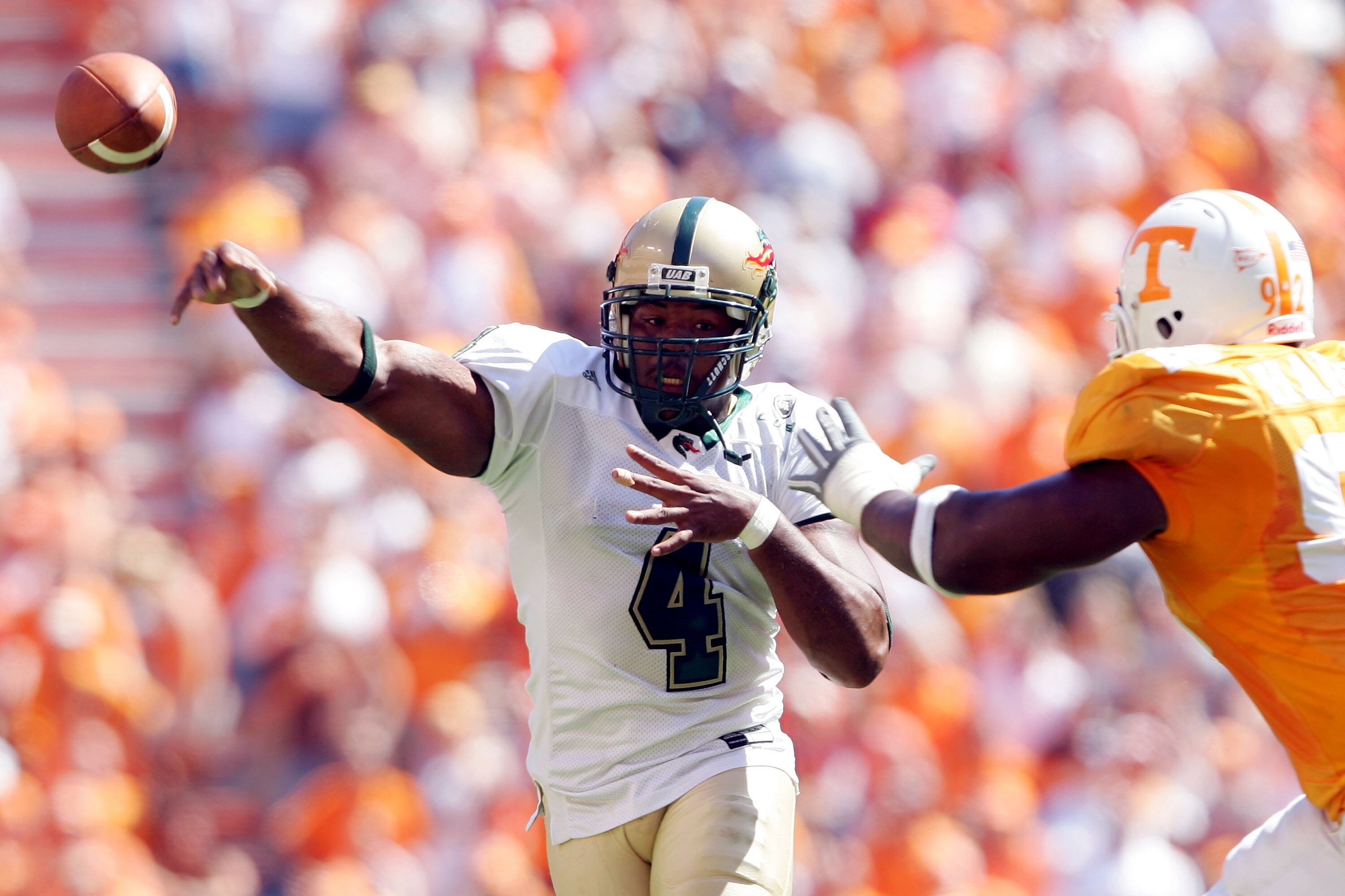 KNOXVILLE, TN - SEPTEMBER 3:  Quarterback Darrell Hackney #4 of UAB passes the ball in the second half as Justin Harrell #92 of Tennessee pressures on September 3, 2005  at Neyland Stadium in Knoxville, Tennessee. The Volunteers defeated UAB 17-10.  (Phot