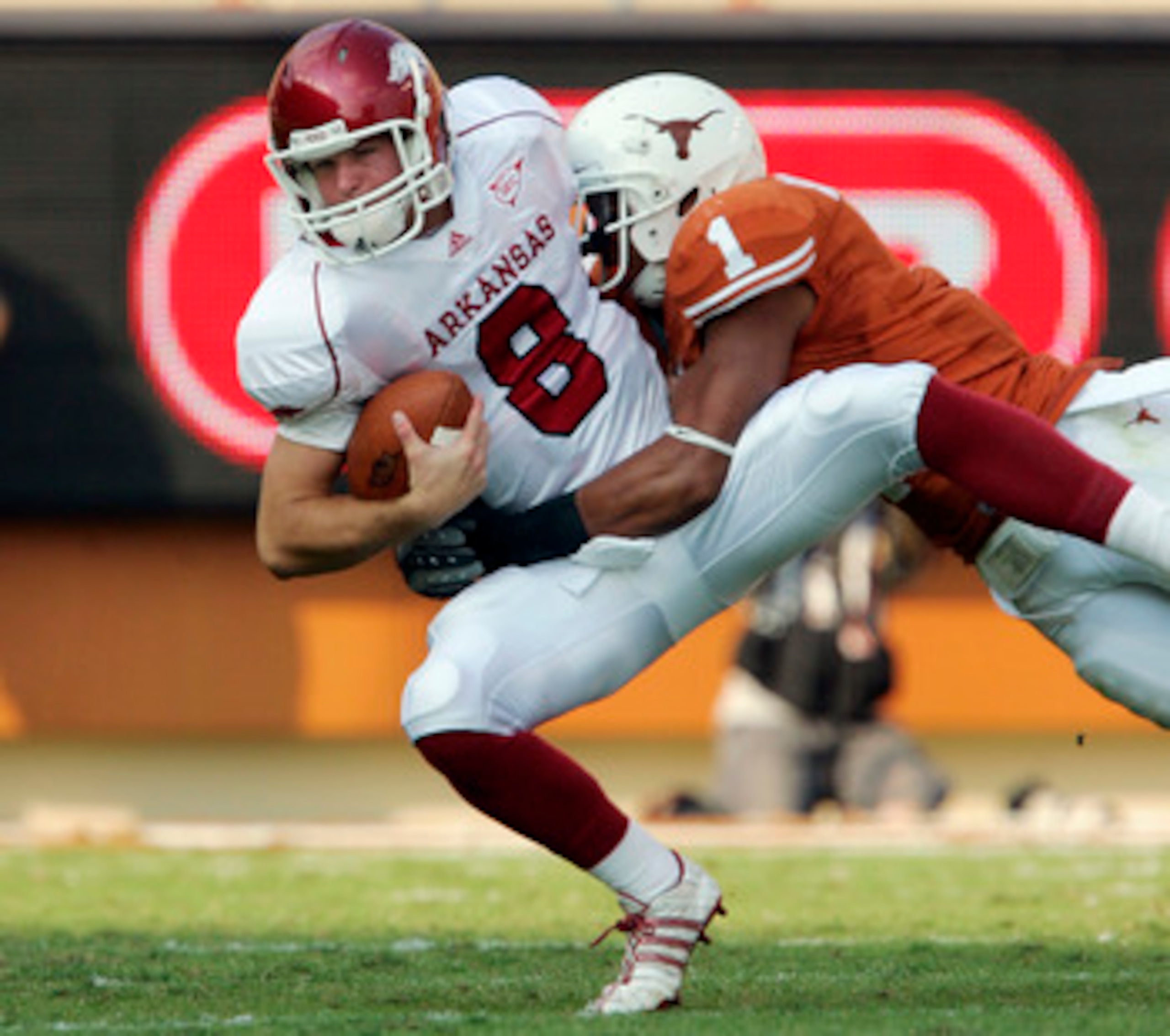 AUSTIN, TX - SEPTEMBER 27:  Linebacker Keenan Robinson #1 of the Texas Longhorns sacks quarterback Tyler Wilson #8 of the Arkansas Razorbacks in the fourth quarter on September 27, 2008 at Darrell K Royal-Texas Memorial Stadium in Austin, Texas. Texas won