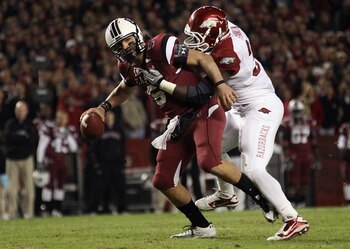 COLUMBIA, SC - NOVEMBER 06: Jerry Franklin #34 of the Arkansas Razorbacks tries to bring down Stephen Garcia #5 of the South Carolina Gamecocks during their game at Williams-Brice Stadium on November 6, 2010 in Columbia, South Carolina. (Photo by Street COLUMBIA, SC - NOVEMBER 06: Jerry Franklin #34 of the Arkansas Razorbacks tries to bring down Stephen Garcia #5 of the South Carolina Gamecocks during their game at Williams-Brice Stadium on November 6, 2010 in Columbia, South Carolina. (Photo by Street
