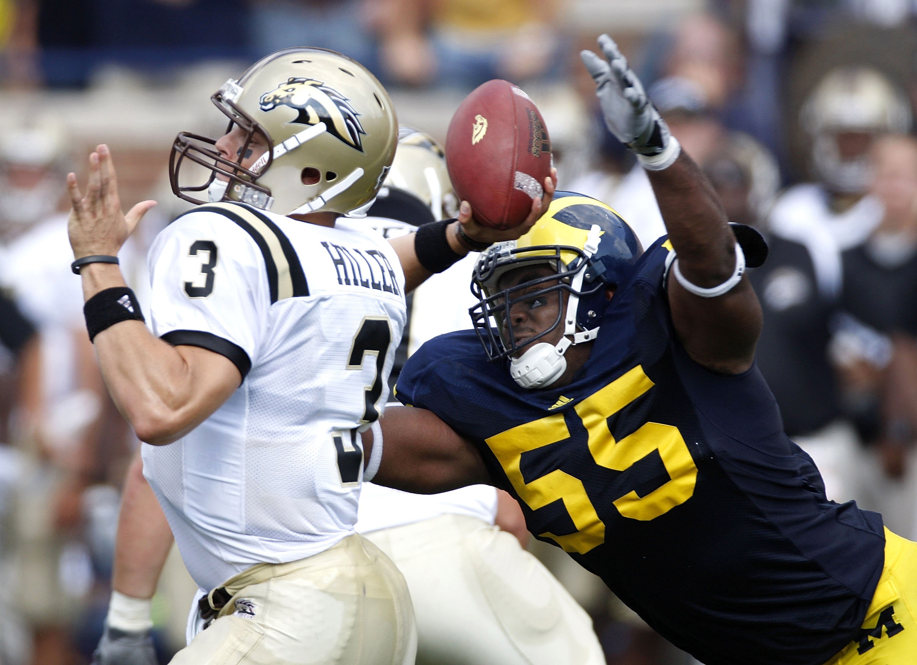 ANN ARBOR, MI - SEPTEMBER 05:  Brandon Graham #55 of the Michigan Wolverines dives for a sack on Tim Hiller #3 of the Western Michigan Broncos on September 5, 2009 at Michigan Stadium in Ann Arbor, Michigan.  (Photo by Gregory Shamus/Getty Images)