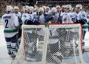 NASHVILLE, TN - MAY 09:  The Vancouver Canucks gather around goalie Roberto Luongo after a win over the Nashville Predators in Game Six of the Western Conference Semifinals during the 2011 NHL Stanley Cup Playoffs at the Bridgestone Arena on May 9, 2011 i