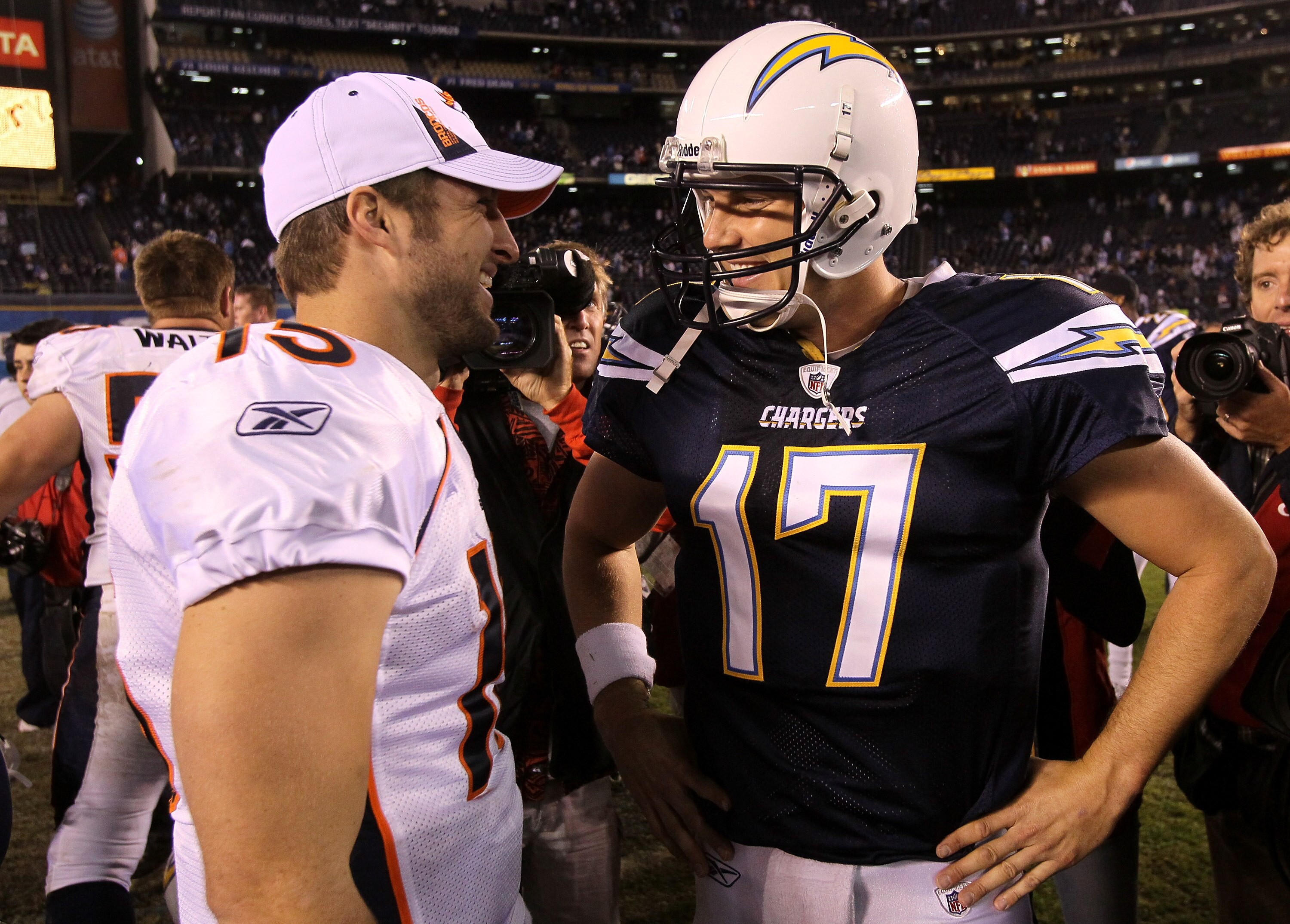 SAN DIEGO - NOVEMBER 22:  Quarterback Philip Rivers #17 of the San Diego Chargers and quarterback Tim Tebow #15 of the Denver Broncos talk after the game at Qualcomm Stadium on November 22, 2010 in San Diego, California. The Chargers won 35-14.  (Photo by