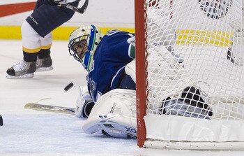 VANCOUVER, CANADA - APRIL 30: Goalie Roberto Luongo #1 of the Vancouver Canucks makes a save against the Nashville Predators while down on the ice during the first period in Game Two of the Western Conference Semifinals during the 2011 NHL Stanley Cup Pla