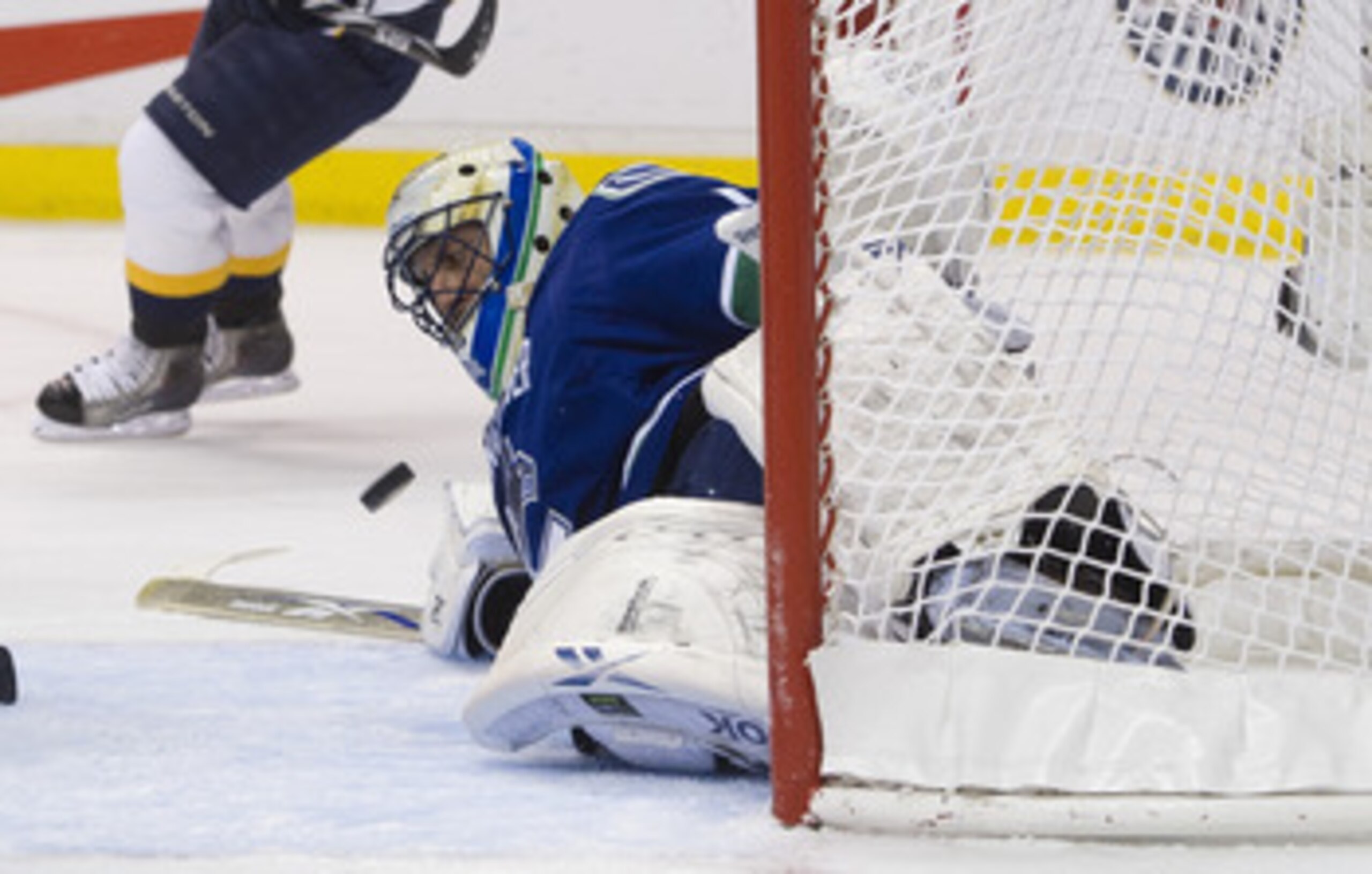 VANCOUVER, CANADA - APRIL 30: Goalie Roberto Luongo #1 of the Vancouver Canucks makes a save against the Nashville Predators while down on the ice during the first period in Game Two of the Western Conference Semifinals during the 2011 NHL Stanley Cup Pla