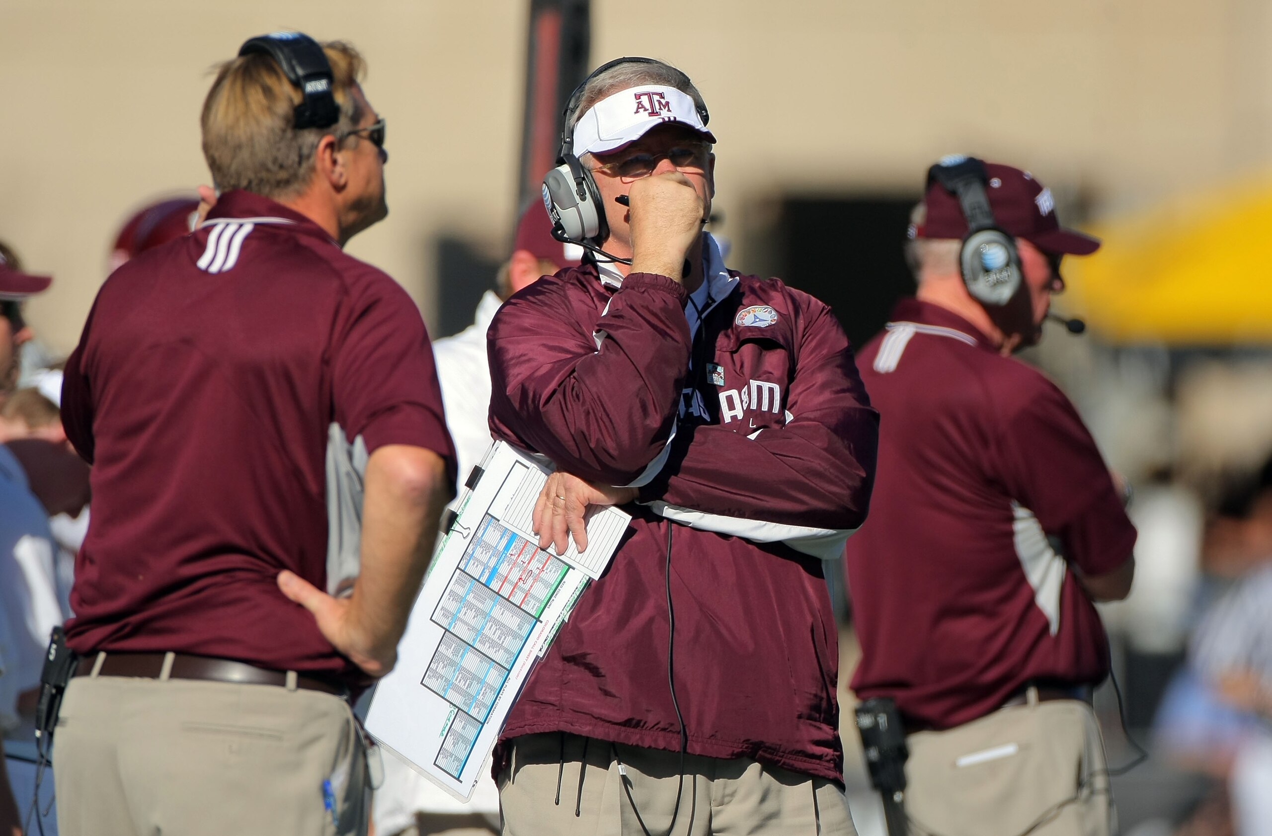 BOULDER, CO - NOVEMBER 07:  Head coach Mike Sherman (C) of the Texas A&M Aggies leads his team against the Colorado Buffaloes during NCAA college football action at Folsom Field on November 7, 2009 in Boulder, Colorado. Colorado defeated Texas A&M 35-34. 