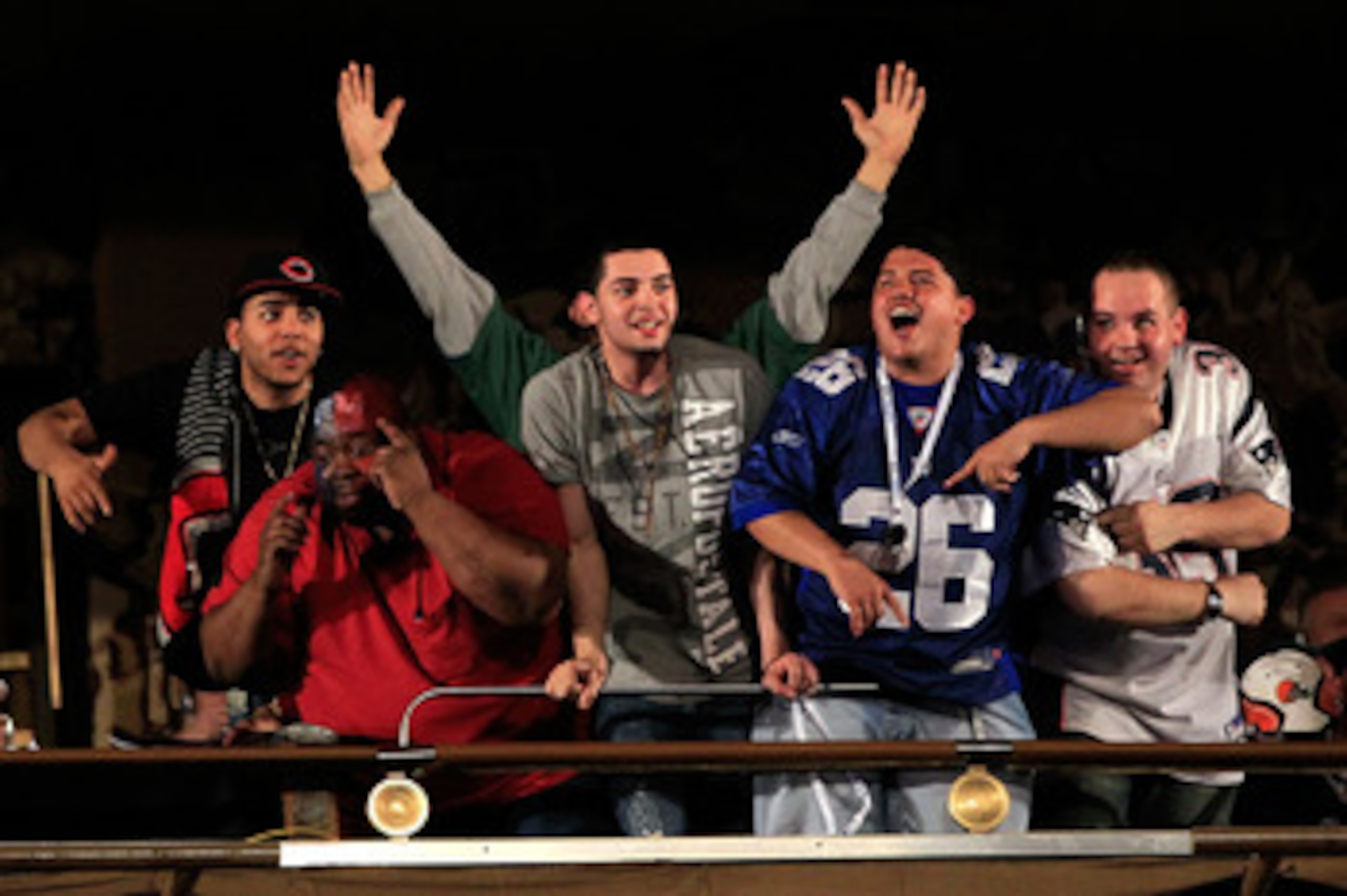NEW YORK, NY - APRIL 28:  Fans of the New York Giants and the New England Patrios cheer in the balcony during the 2011 NFL Draft at Radio City Music Hall on April 28, 2011 in New York City.  (Photo by Chris Trotman/Getty Images)