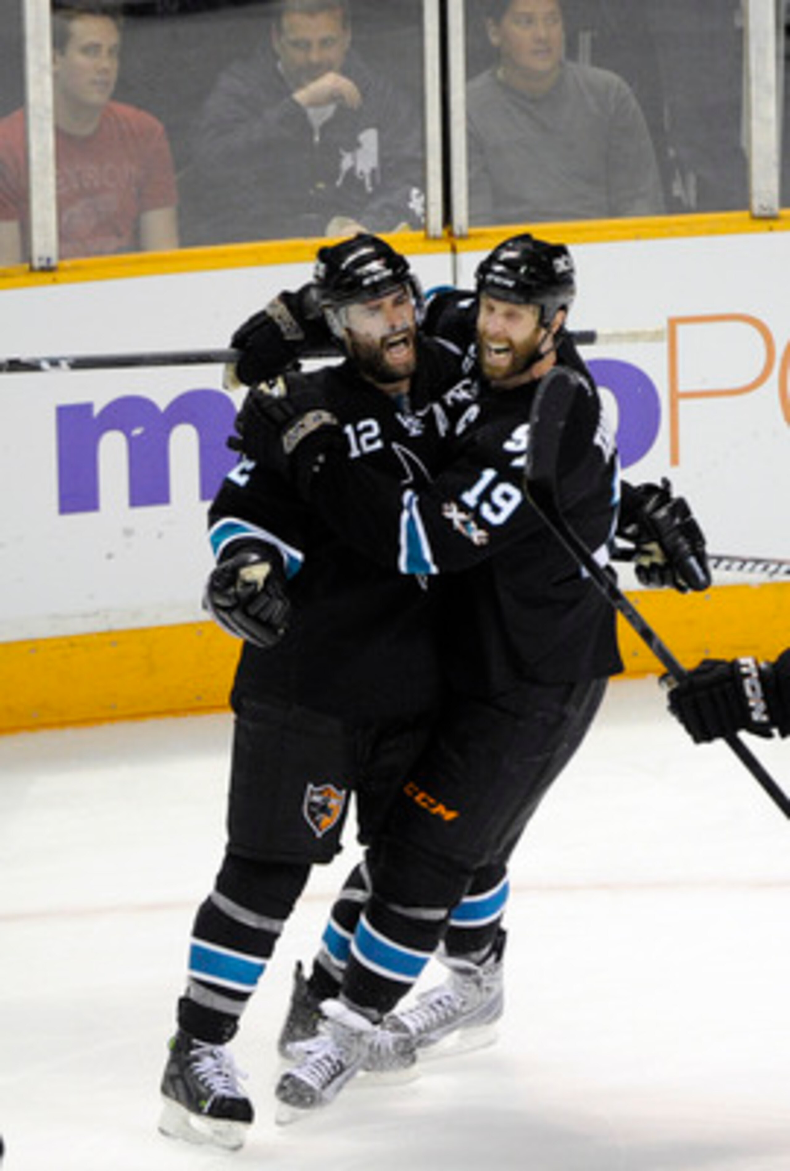 SAN JOSE, CA - MAY 12: Patrick Marleau #12 and Joe Thornton #19 of the San Jose Sharks celebrates after Marleau scored a goal in the third period against the Detroit Red Wings in Game Seven of the Western Conference Semifinals  during the 2011 NHL Stanley