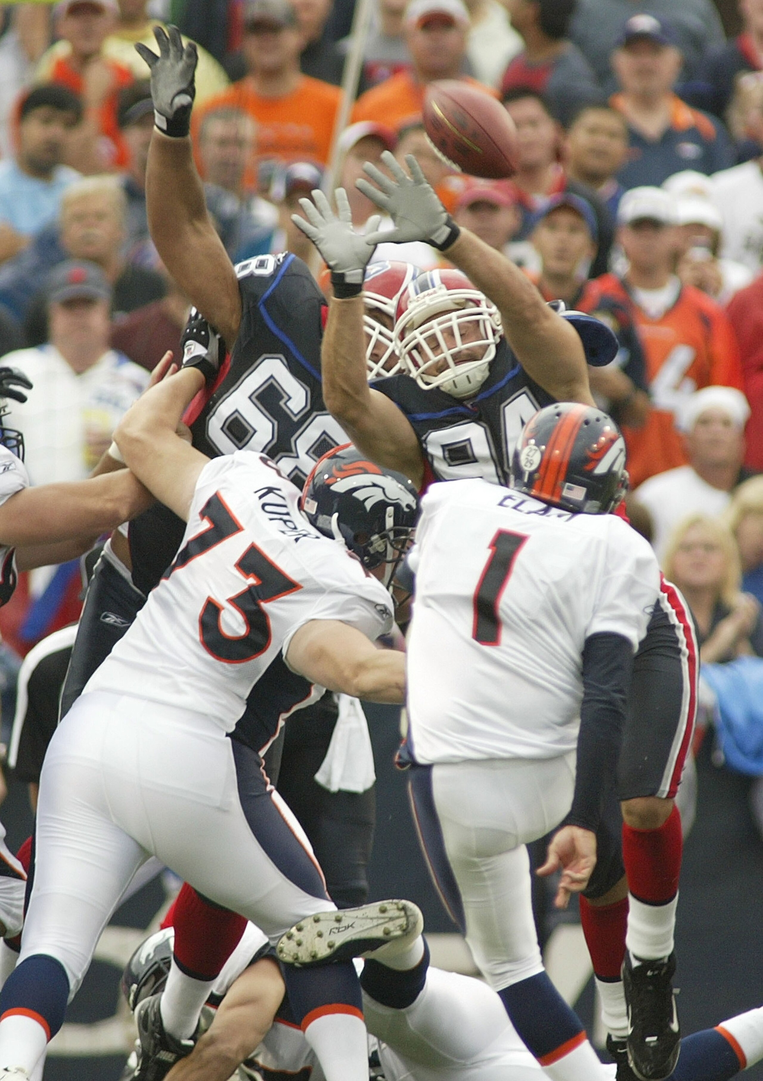 ORCHARD PARK, NY - SEPTEMBER 9: Aaron Schobel #94 of the Buffalo Bills attempts to block a field goal by Jason Elam #1 of the Denver Broncos at Ralph Wilson Stadium September 9, 2007 in Orchard Park, New York. Denver won 15-14. (Photo by Rick Stewart/Ge ORCHARD PARK, NY - SEPTEMBER 9: Aaron Schobel #94 of the Buffalo Bills attempts to block a field goal by Jason Elam #1 of the Denver Broncos at Ralph Wilson Stadium September 9, 2007 in Orchard Park, New York. Denver won 15-14. (Photo by Rick Stewart/Ge
