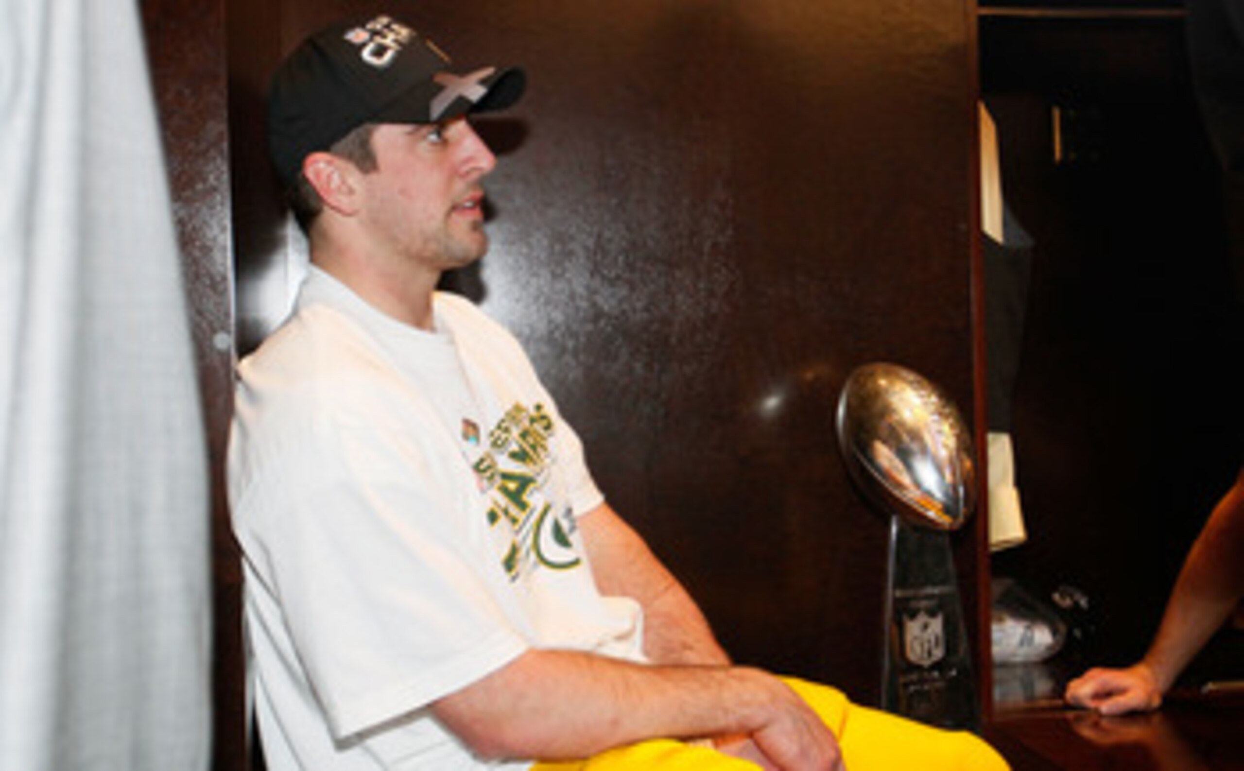 ARLINGTON, TX - FEBRUARY 06:  Super Bowl MVP Aaron Rodgers #12 of the Green Bay Packers celebrates in the locker room with the Vince Lombardi Trophy after the Green Bay Packers defeated the Pittsburgh Steelers 31 to 25 in Super Bowl XLV at Cowboys Stadium