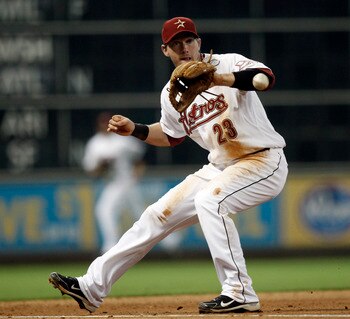 HOUSTON - MAY 11:  Third baseman Chris  Johnson #23 of the Houston Astros fields a ground ball during a baseball game against the Cincinnati Reds at Minute Maid Park on May 11, 2011 in Houston, Texas.  (Photo by Bob Levey/Getty Images)