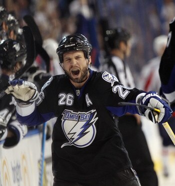 TAMPA, FL - MAY 04:  Martin St. Louis #26 of the Tampa Bay Lightning celebrates his goal at 16:52 of the third period against the Washington Capitals in Game Four of the Eastern Conference Semifinals during the 2011 NHL Stanley Cup Playoffs at the St Pete