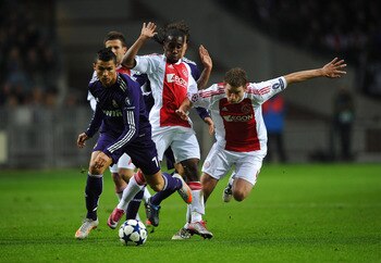AMSTERDAM, NETHERLANDS - NOVEMBER 23: Cristiano Ronaldo of Real Madrid battles for the ball with Jan Vertonghen of Ajax during the UEFA Champions League Group G match between AFC Ajax and Real Madrid at the Ajax Arena on November 23, 2010 in Amsterdam, Ne