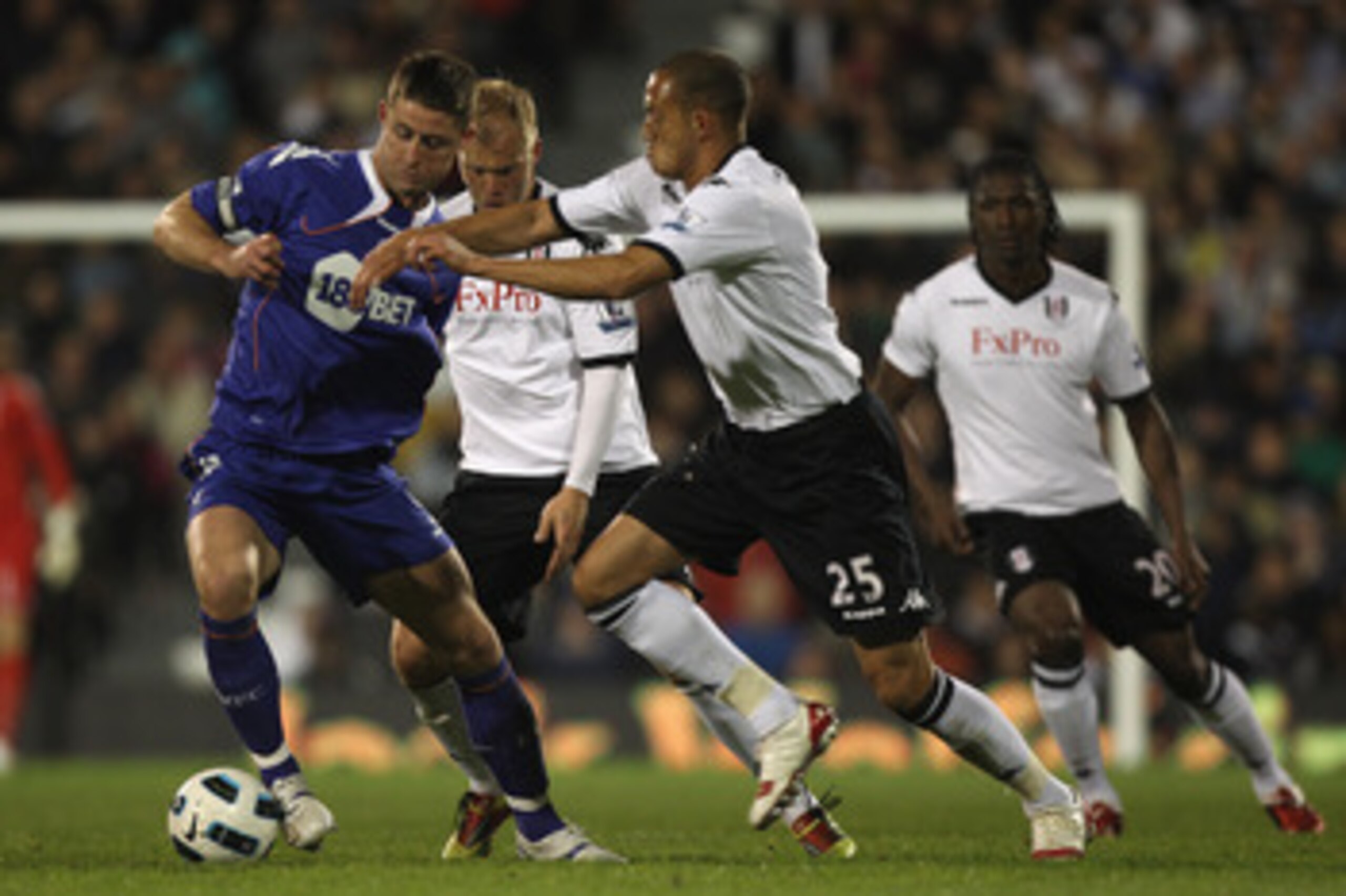 LONDON, ENGLAND - APRIL 27: Gary Cahill (L) of Bolton holds off Bobby Zamora (R) during the Barclays Premier League match between Fulham and Bolton Wanderers at Craven Cottage on April 27, 2011 in London, England.  (Photo by Michael Steele/Getty Images)