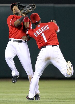 ARLINGTON, TX - MAY 07:  (L-R) Centerfielder Julio Borbon #20 avoids Elvis Andrus #1 of the Texas Rangers while making the fly out against Alex Rodriguez #13 of the New York Yankees in the 7th inning at Rangers Ballpark in Arlington on May 7, 2011 in Arli