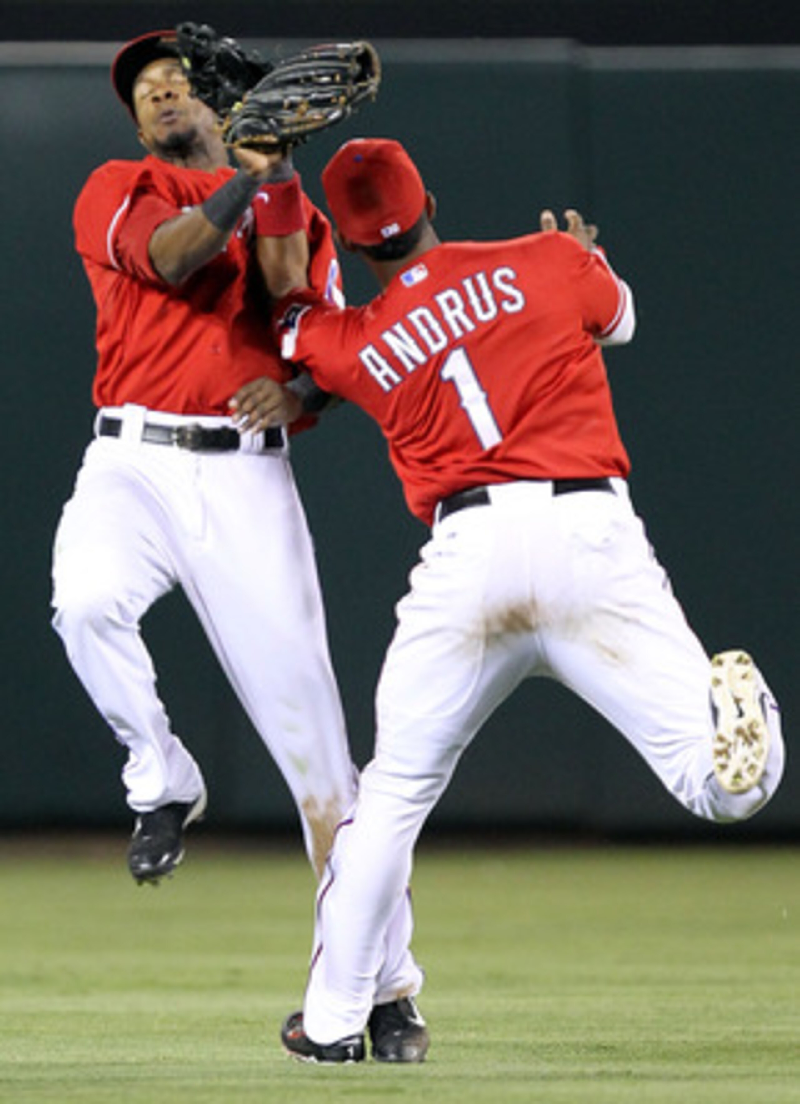 ARLINGTON, TX - MAY 07:  (L-R) Centerfielder Julio Borbon #20 avoids Elvis Andrus #1 of the Texas Rangers while making the fly out against Alex Rodriguez #13 of the New York Yankees in the 7th inning at Rangers Ballpark in Arlington on May 7, 2011 in Arli